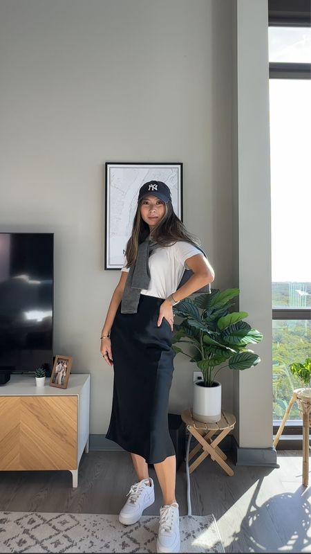 Everyday outfit idea // yankee hat, cashmere sweater, white tshirt, black slip skirt, white sneakers // casual chic, French style, Parisian chic

#LTKstyletip #LTKfindsunder50 #LTKfindsunder100