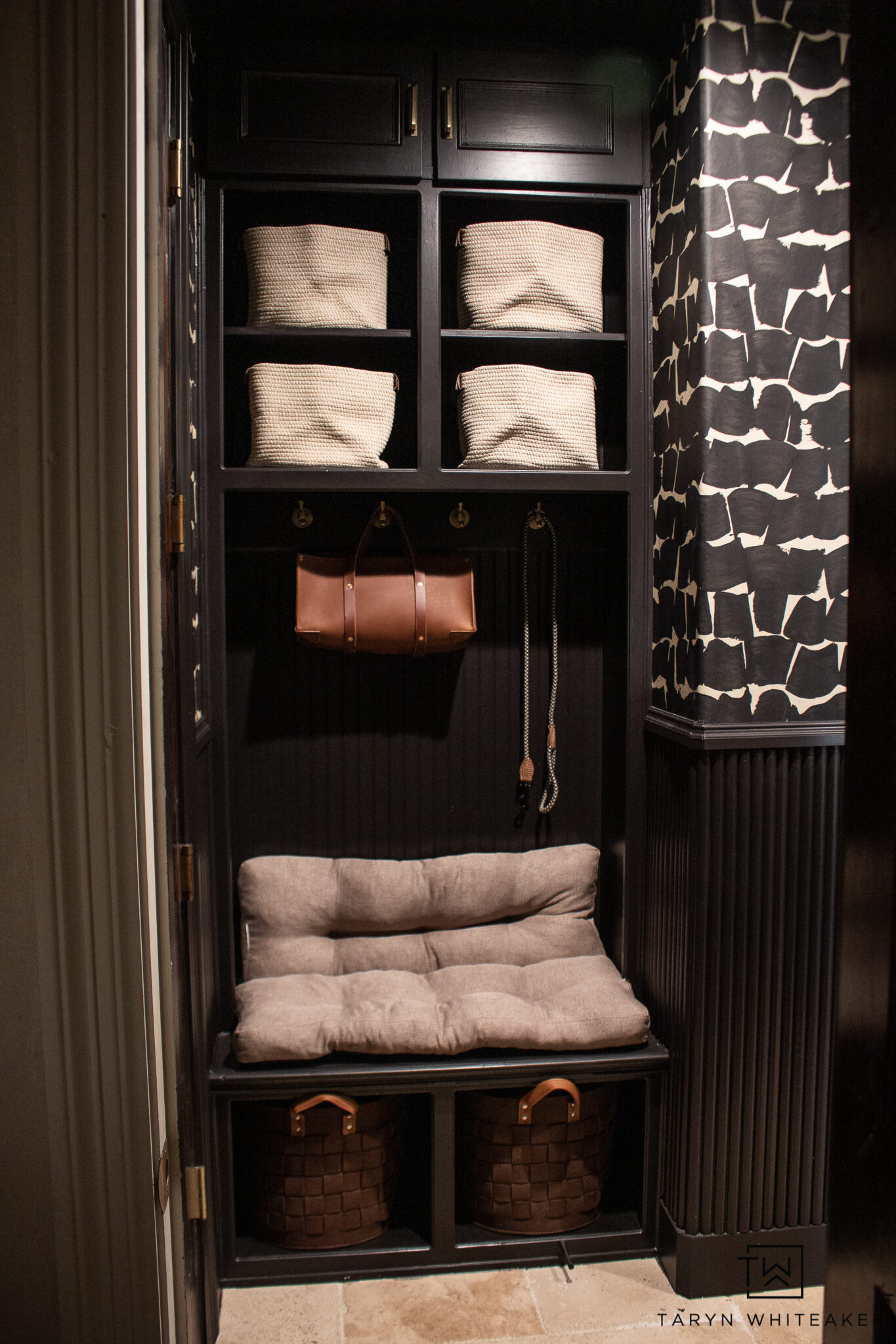 Proof that small spaces can still have big personality. Moody mudroom decor, black and white wallpaper, brass mirror, and classic home accents all in one spot.

#LTKHome #LTKSeasonal #LTKU