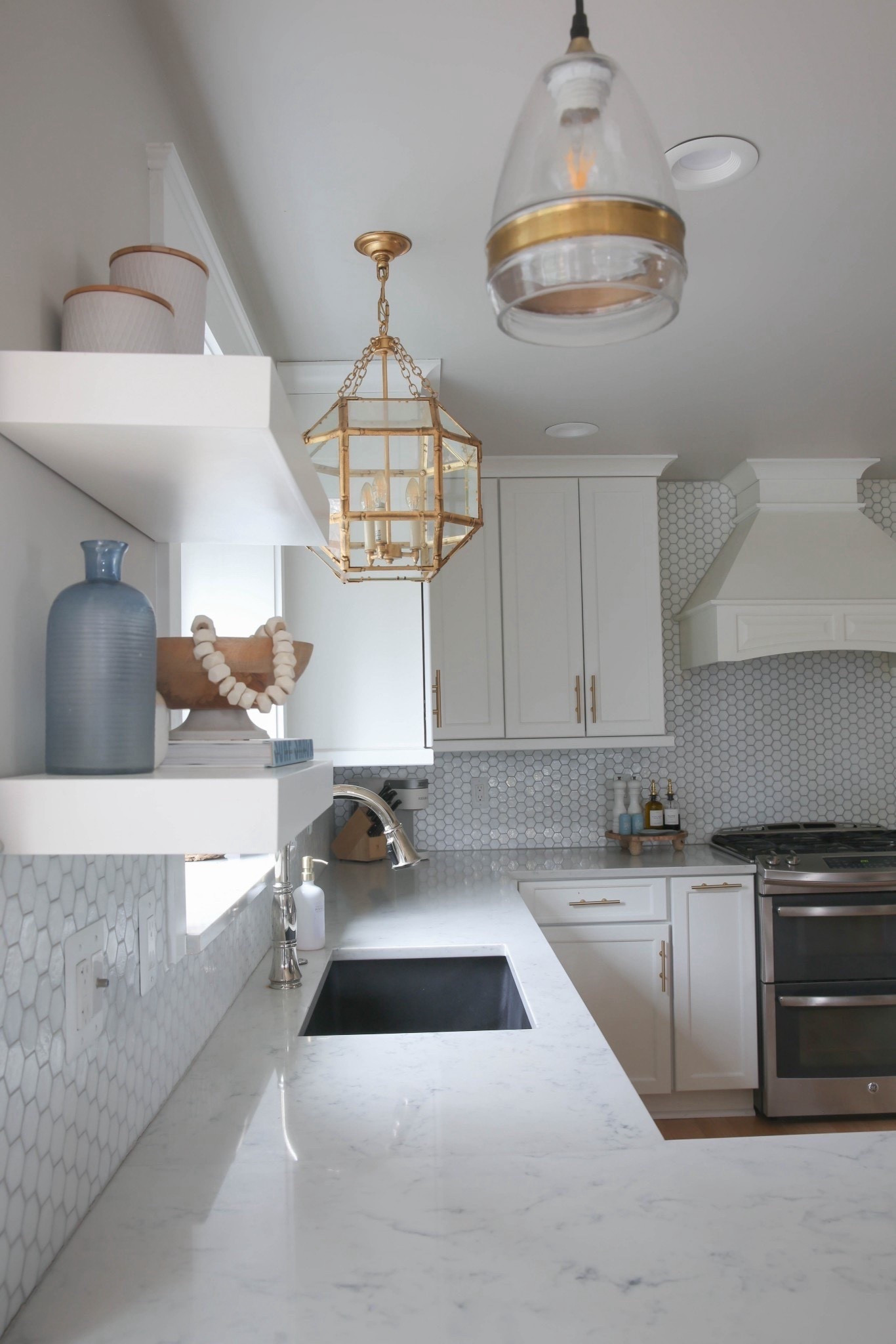 My white kitchen with a designer brass cage pendant light is clean, bright, and perfectly elevated with coastal-inspired style. I love how the warm brass tones and crisp white backdrop make this space feel airy, modern, and effortlessly chic. 



#LTKHome #LTKU #LTKSaleAlert
