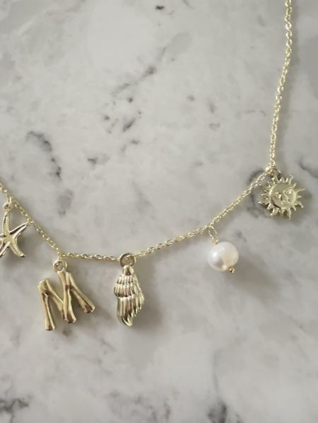 Amazing charm necklace. Pretty beach themed charms! Under $20

#LTKFindsUnder50 #LTKSummerSales #LTKStyleTip