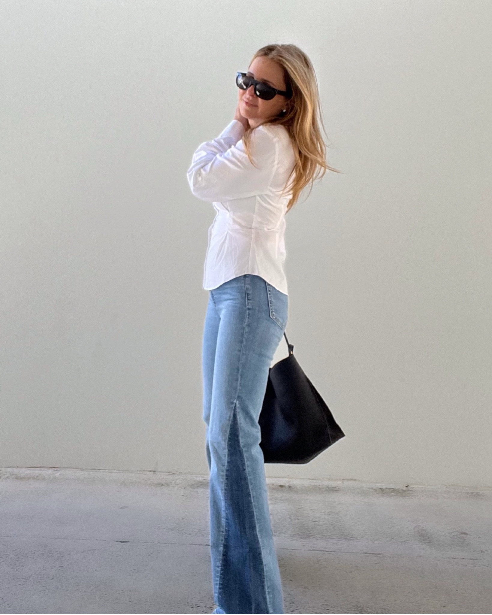 BACK IN STOCK - high rise patched 70s flare jeans 💫 I’m also wearing a white button down slim fitted shirt with a black hobo bag and black clogs.

Jeans size 26. 

#LTKSeasonal #LTKstyletip #LTKworkwear