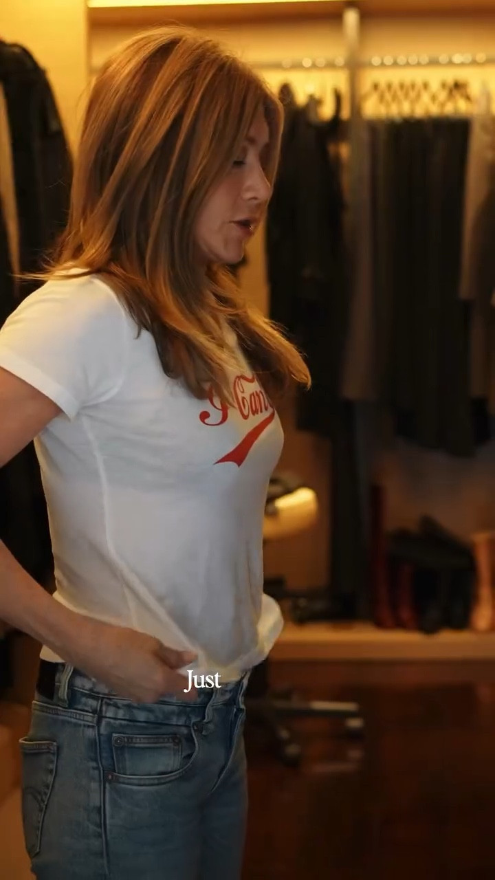 Jennifer Aniston's Chewed Hem Crop Straight Leg Jeans and graphic T-shirt favorite hair products ￼