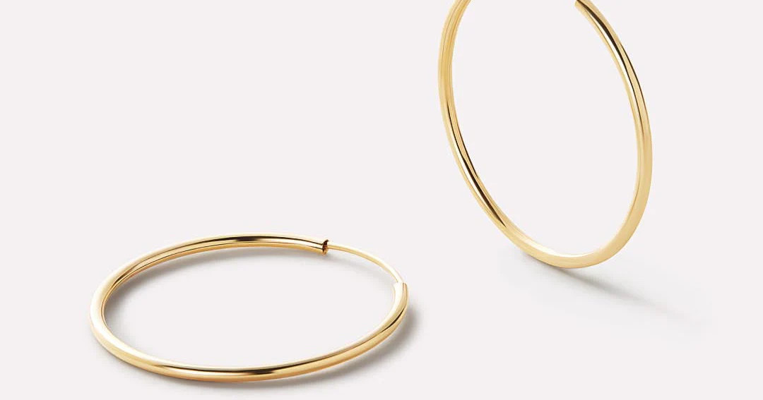 Made with 100% recycled solid gold, our waterproof and tarnish-proof small gold hoop earrings are... | Ana Luisa