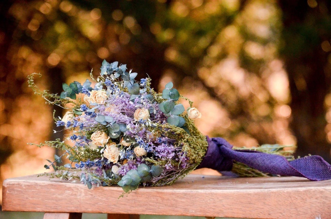 Add soft romance to your space with this fragrant dried bouquet featuring pink and ivory roses, lavender, baby’s breath, eucalyptus, and airy Indian rice grass. Finished with a purple linen ribbon, this charming arrangement brings natural beauty and delicate color to shelves, tables, or gifting moments. Shipped from Virginia for a shorter journey that’s kinder to the planet. #LTKHome #DriedFlowers #HomeDecor #FloralDecor #EtsyFinds #VirginiaMade #RomanticDecor #LavenderDecor #GiftIdeas #NaturalHome

#LTKWedding #LTKSeasonal #LTKHome