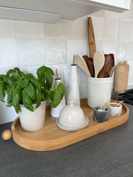 Kitchen styling 

Kitchen tray
Butter dish 
Crock 
Wooden spoons
Olive oil carafe 
Salt and pepper 

#LTKunder100 #LTKstyletip #LTKhome