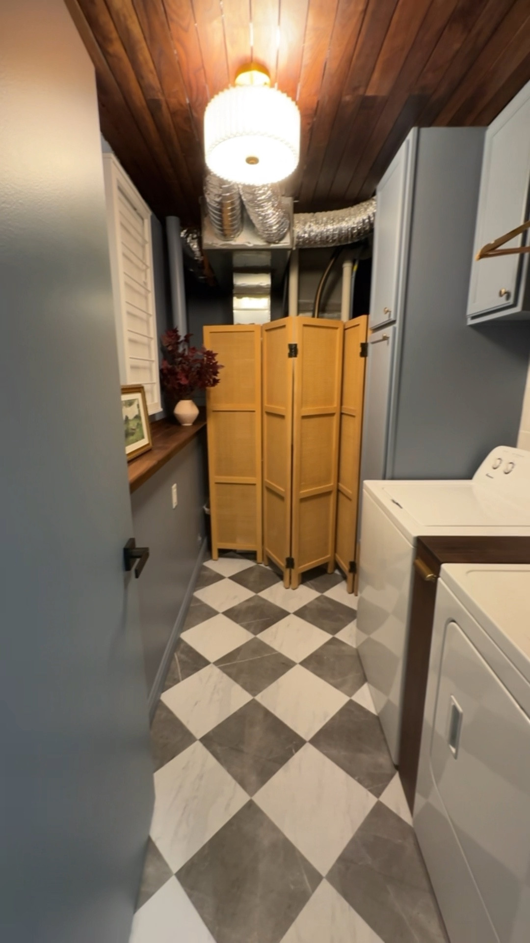 Laundry room renovation reveal! 

Blue cabinets, checkered tile floor, peel and stick tiles, rattan room divider, white wall drying rack, burgundy faux plant, Amazon Art, brass knobs, dryer balls, scalloped basket, gold wall rabbit trinket, white woven baskets, white handcraft tile,  wooden hangers 

#LTKHome #LTKStyleTip #LTKWatchNow