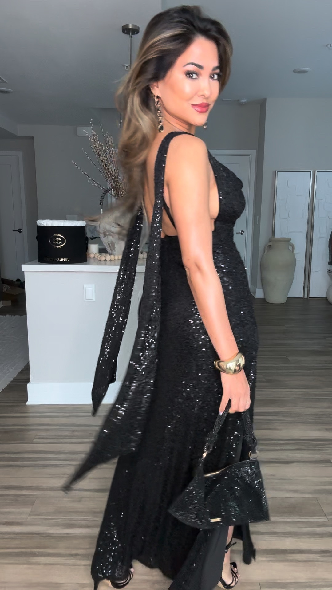 GRWM: A Sparkly Black Evening Dress✨ 

I am OBSESSED with the back of this dress!  

• #todaysoutfit #outfit #fashion #styletips #outfitideas #grwm #fashionstyle #styling #wedding #weddingguest 

Outfit Breakdown:
dress  — @showpo 
shoes — @egoofficial 
earrings — @ettika 
bag — @cultgaia 
perfume — @maisonvalentino x @valentino.beauty 
lip gloss— @anastasiabeverlyhills 
robe — @victoriassecret
Body shimmer — @soldejaneiro

#LTKbeauty #LTKfindsunder50 #LTKstyletip