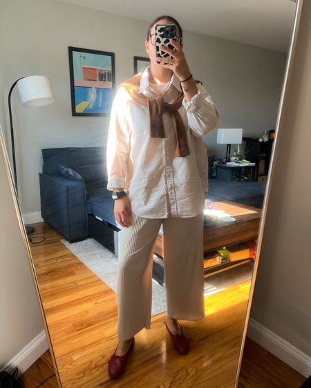 Spring faves - a classic oversized oxford button down, a cashmere crew neck sweater draped over the shoulders, comfy pleated pants, and some classic ballet flats

#LTKstyletip #LTKSeasonal #LTKshoecrush