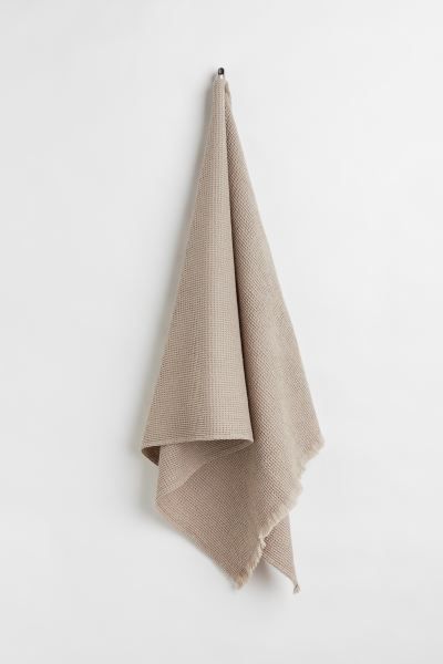 Conscious choice  Bath towel in waffled cotton fabric. Fringe at short sides and hanger loop on o... | H&M (US)