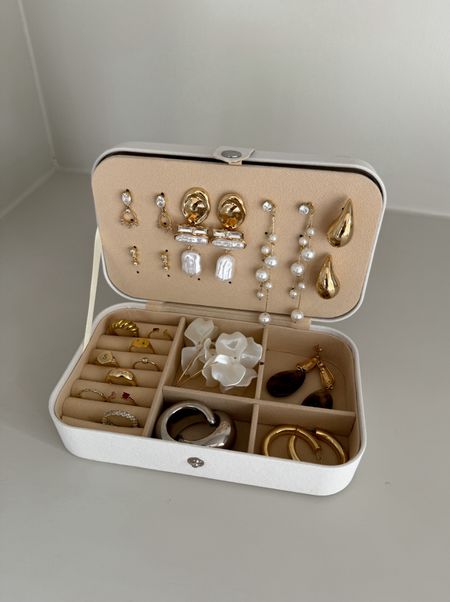 The absolute best travel jewelry organizer for all sizes of jewelry. Has adjustable trays, 6 ring rows, up to 14 pairs of earrings, and has hanging hooks for 5 necklaces 

Amazon find | Amazon travel must haves | jewelry box | jewelry case | gift ideas for her 

#LTKfindsunder50 #LTKsalealert #LTKtravel