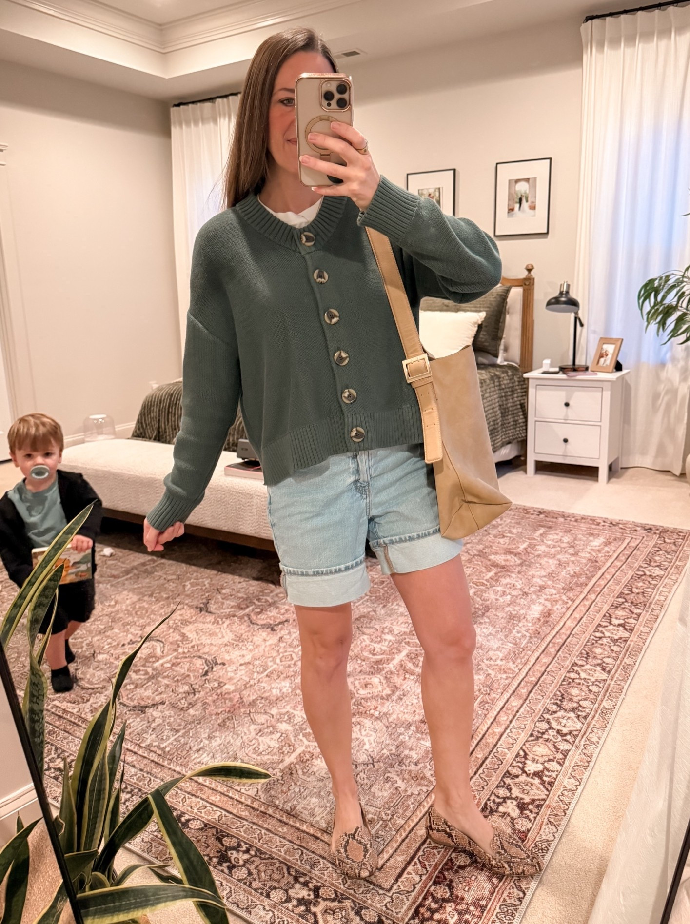 Committing to fall even if it’s 83° today 🍂 This Quince cardigan is one of those easy fall mom outfit pieces that works with denim shorts now and jeans later. Finished with snake-print flats for an easy school drop-off, errands, casual fall outfit, or weekend look.

Sizing: Quince cardigan S | shorts + shoes are older, linking similar

Quince promo code: INFG-26LINENANDLIGHTCO10 for 10% off your first order 🤍