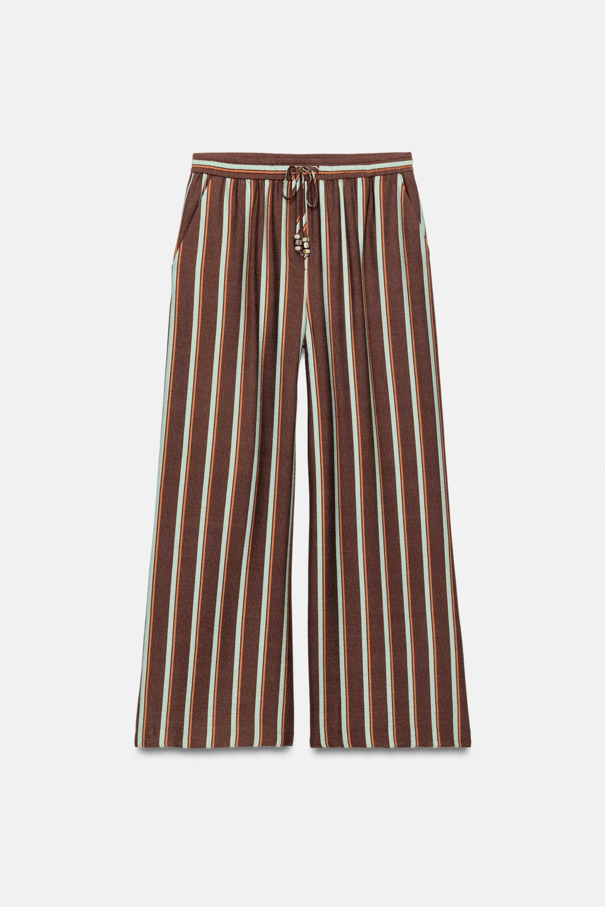 High-waist trousers with an elastic waistband, adjustable with beaded drawstrings. Featuring fron... | Zara UK
