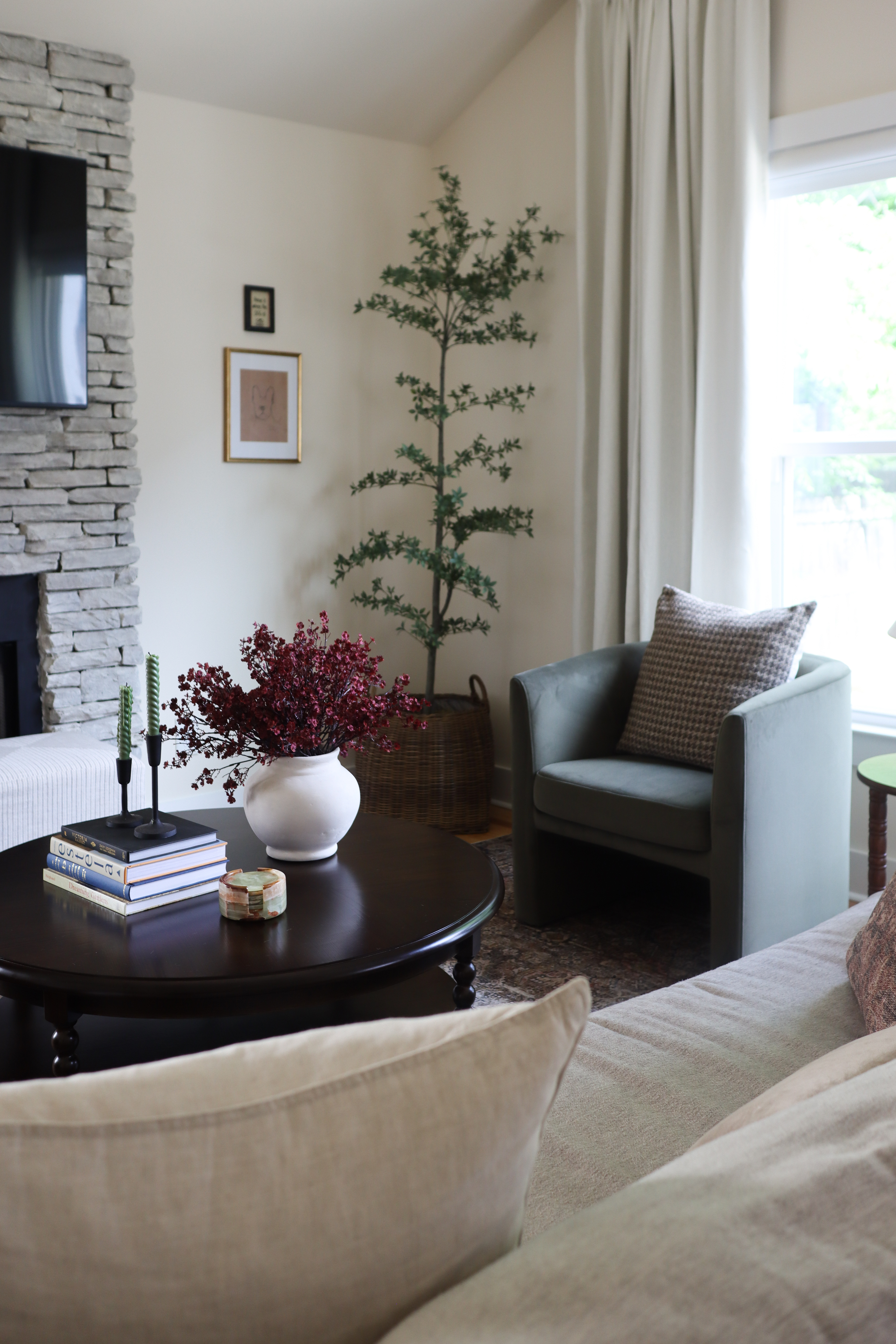 This transitional living room makeover is proof that you don’t need to start from scratch to completely transform a space.✨ We kept the existing sofa and chairs and focused on layered accessories, a new layout, and a softer color palette to elevate the room.

A few key updates — a polished black hutch, a timeless, dark wood coffee table, and a fresh rug — made all the difference. We even whitewashed the fireplace to give it a more modern feel while preserving character.

Linked all the exact (or similar) pieces I used to help create this cozy, elevated, transitional look. Perfect for anyone wanting to refresh their space without buying all new furniture! 🛋️

#transitionalstyle #livingroomdesign  

 #LTKHome #LTKFamily