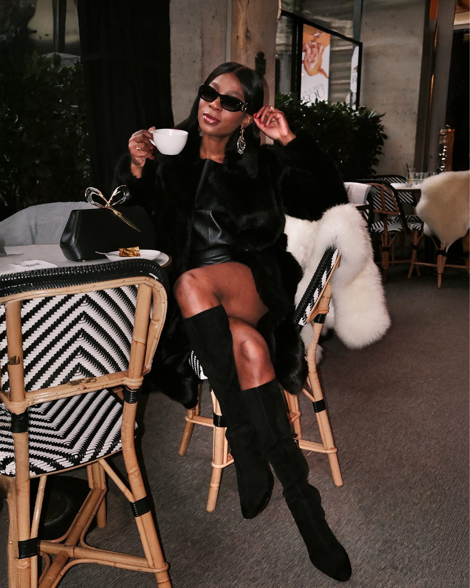 Cosy faux leather, faux fur winter look. Black velvet knee high boots, faux black leather top, faux black leather skirt, black faux fur coat, Cartier Sunglasses, statement jewellery, statement bag, Alexis Bittar 🖤 

#LTKluxury #LTKbag #LTKwinter