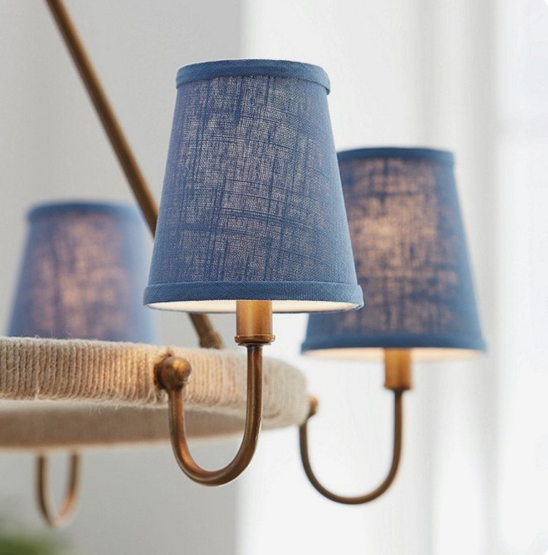 This chandelier features soft blue fabric shades that diffuse a warm, inviting glow, it’s accented with antique brass arms and a rope-wrapped frame for a touch of texture and character. Perfect for coastal, farmhouse, or transitional interiors.

#LTKHome