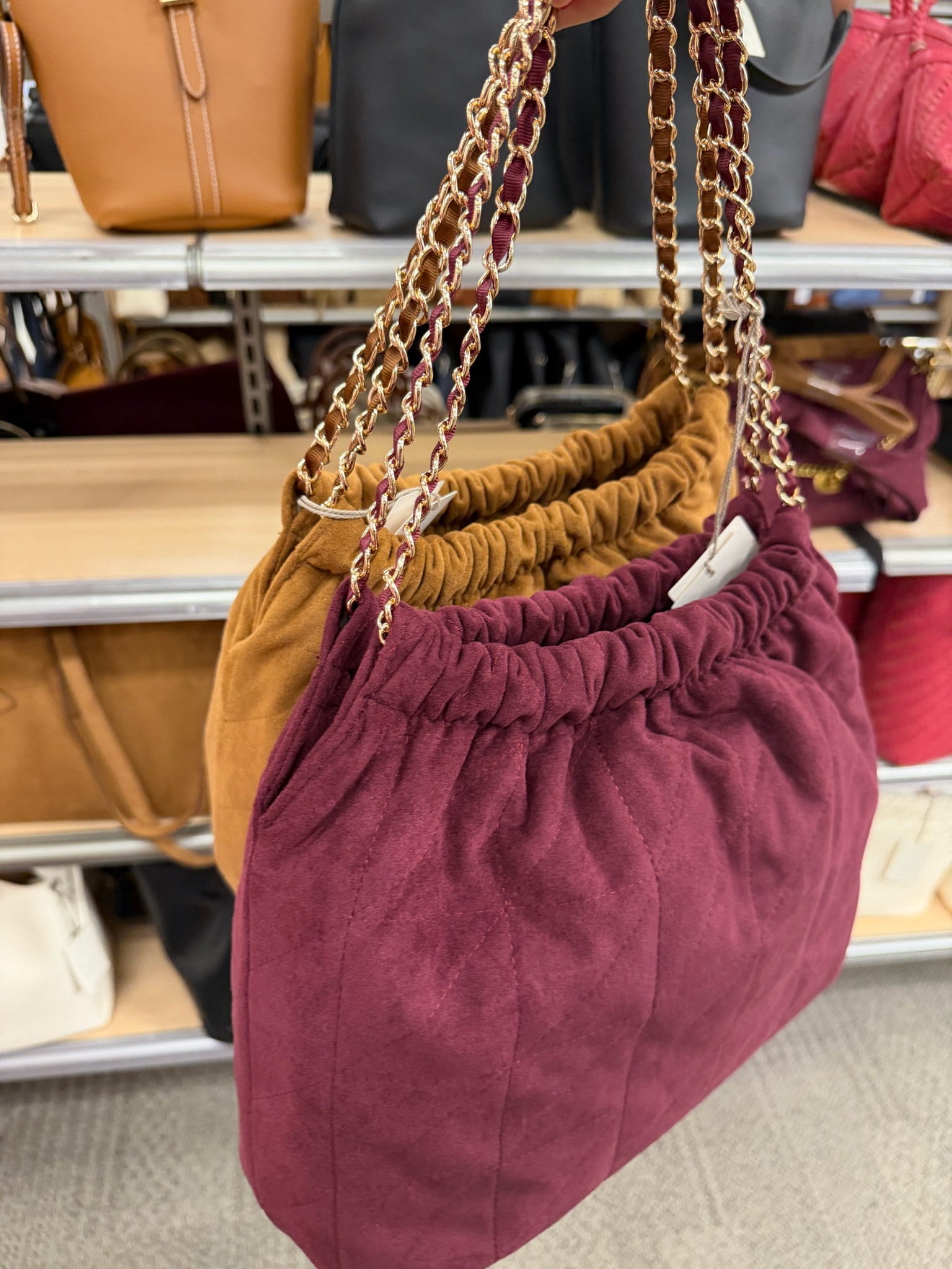 These suede shoulder bags are such a good way to bring richer color and texture into fall outfits. The burgundy and warm caramel shades paired with the gold chain straps make even a simple jeans and sweater look more interesting.

suede handbag, burgundy handbag, fall handbag, shoulder bag, chain strap bag, fall accessories, burgundy accessories, caramel brown bag, women’s handbags, fall fashion, TheMomInStyle

#LTKootd #LTKOver40 #LTKSeasonal