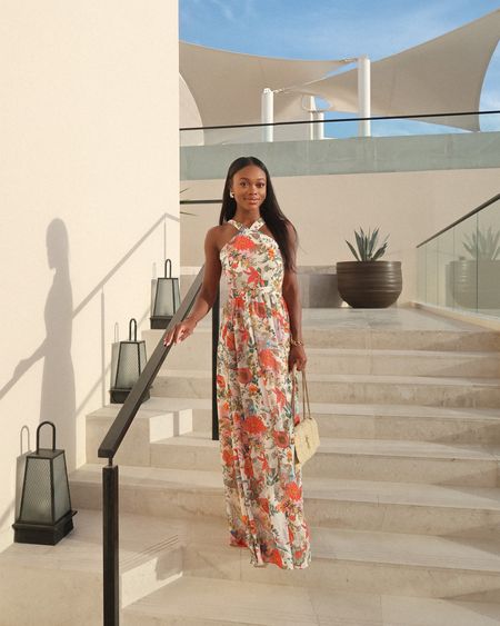 One of my favorite looks from Cabo! This floral maxi dress is under $100 and would be the perfect vacation or wedding guest dress. I am wearing a size small! Styled it with my YSL raffia bag! 

#LTKSeasonal #LTKwedding #LTKunder100