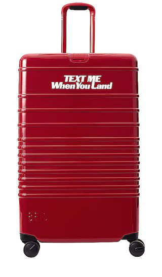 The Large Check-in Roller in Text Me Red | Revolve Clothing (Global)