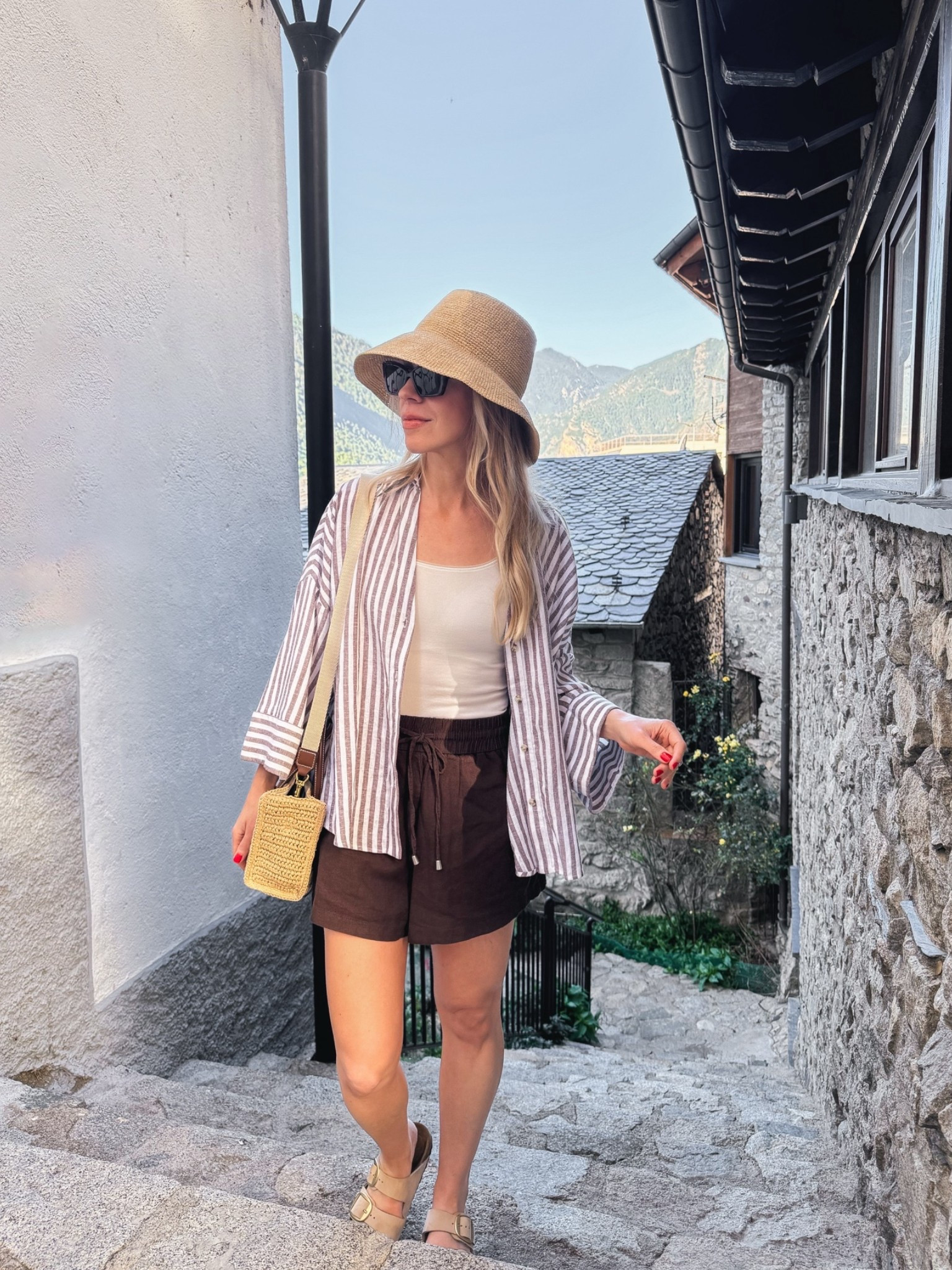 Summer vacation outfit, striped linen shirt, brown linen shorts, @Janessa Leone straw bucket hat

#LTKTravel #LTKSeasonal #LTKOver40