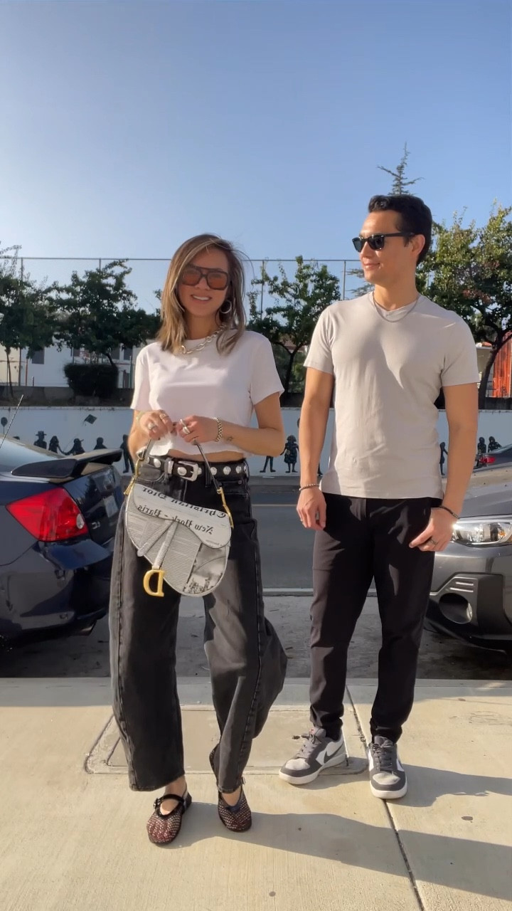 Fit check fail 😂💀 Forever matching in our daily uniform 🎬🖤🤍 I’m wearing my favorite crop top that’s wrinkle free (it’s on sale for $28!). Styled with a chunky necklace (on sale), statement belt (worth the splurge but also shared a similar version for less) and barrel jeans that’s been on heavy rotation. I wasn’t too sure about the mesh ballet flats initially but they grew on me. My sunnies are on sale— 2 for 1. 

The hubby is wearing the best men’s T-shirt—quality is 💯 and it’s so soft. His joggers are breathable, wrinkle free, elevated for casual + going out and on sale!

Casual outfit, summer outfit, fall outfit, crop top, chunky jewelry, necklace, statement belt, barrel jeans, jeans, mesh flats, sunglasses, men’s T-shirt, men’s joggers, men’s style, men’s fashion, couple outfits, couple style, sale, Nike sneakers, The Stylizt 




#LTKMens #LTKFindsUnder100 #LTKSaleAlert