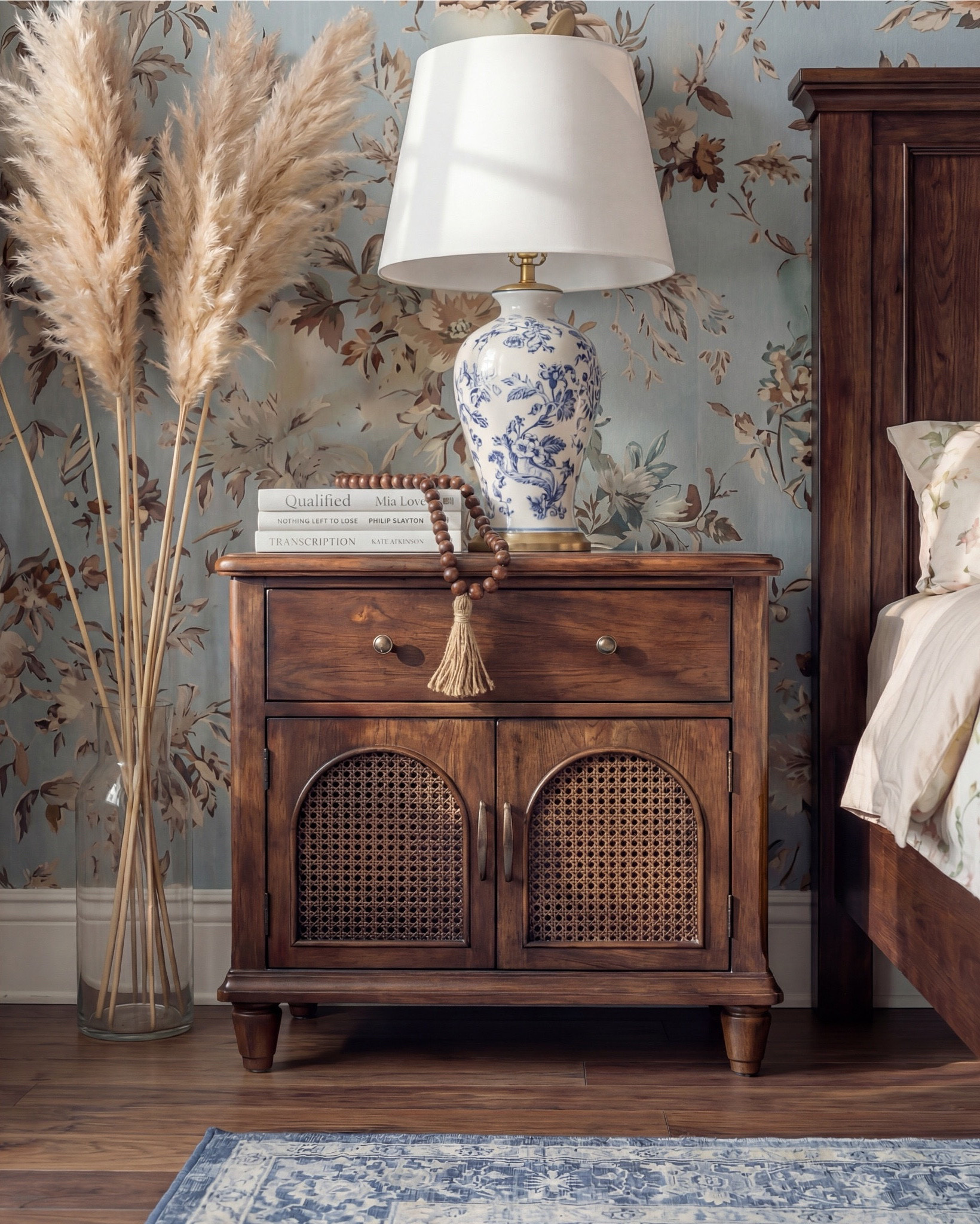 Bedroom Refresh : Shop The Look.
This bedroom is giving cozy vintage charm with a dreamy blue twist. The floral wallpaper sets the entire mood—soft, nostalgic, and full of that storybook warmth that instantly makes a space feel lived-in and loved. The dark wood bed adds richness, grounding the palette with a timeless, heirloom feel.

The blue accent pillows and that chunky knit throw tie the tones together so effortlessly. And the ceramic lamps with the blue chinoiserie pattern? They add the perfect touch of classic elegance. Even the pampas brings in a little softness and movement that makes the whole room feel airy.

The upholstered bench at the foot of the bed is such a luxe finishing touch—layered, textural, and functional. Combined with the blue patterned rug, everything flows in the most calming, cohesive way.

Shop the Look:
• Blue floral wallpaper
• Dark wood bed frame
• Chunky knit blue throw
• Blue patterned area rug
• Cream upholstered bench
• Blue + cream accent pillows
• Chinoiserie-style ceramic table lamps
• Pampas stems for softness
• White decor books
• Brown decor beads

#LTKsale #LTKhome #LTKstyletip