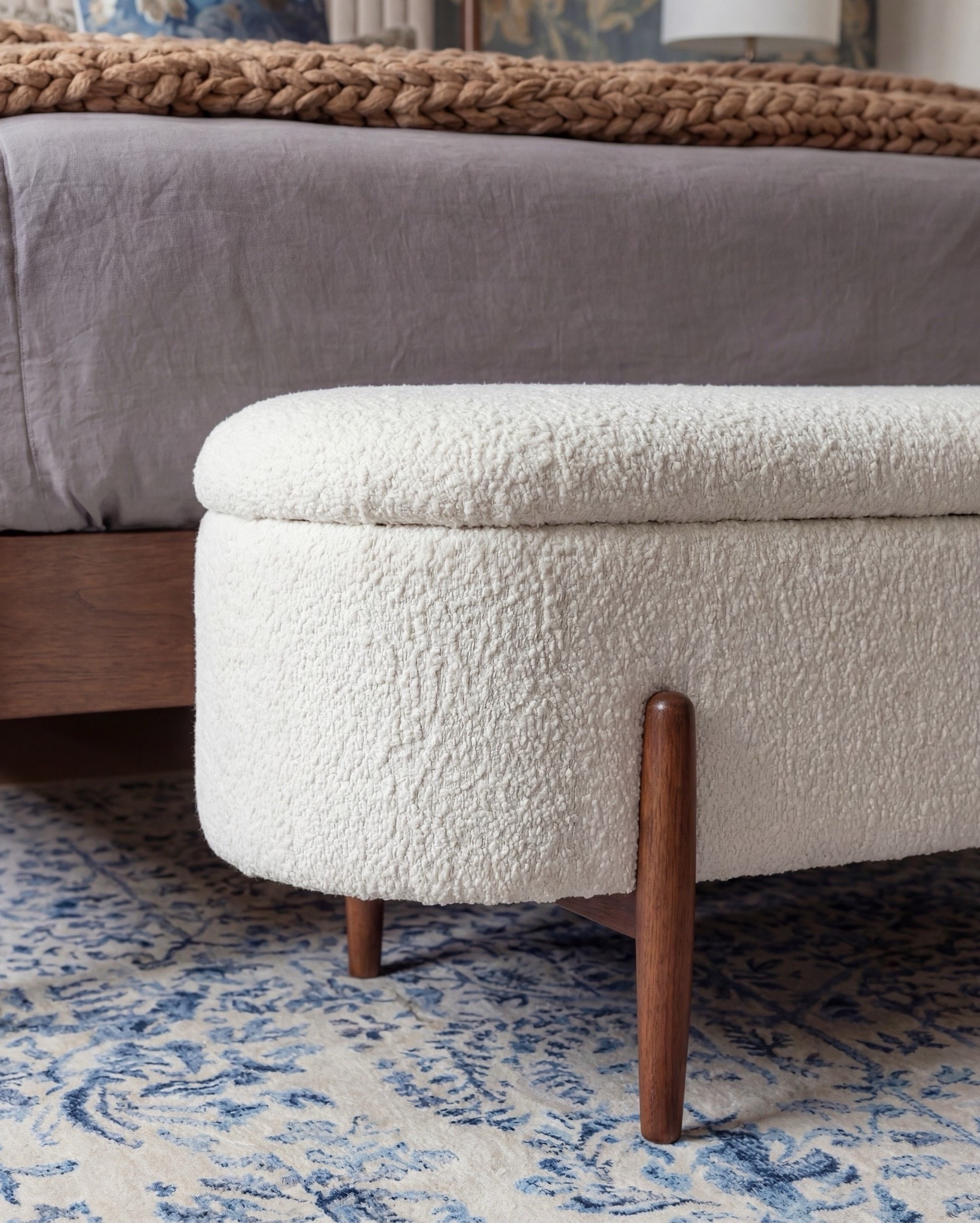 Shop the Look: Bedroom Refresh
• Warm-wood platform bed frame
• Vertical-channel upholstered headboard
• Gray duvet cover + layered sheet set
• Mixed blue + neutral accent pillows
• Oversized chunky knit throw blanket
• Shearling-style upholstered storage bench at the foot of the bed
• Pair of dark-wood campaign-style nightstands with brass hardware
• White drum-shade table lamps with blue glass bases
• Blue decorative bowls
• Bead garland décor
• Stack of books (nightstand styling)
• Framed oversized floral artwork above the bed
• Blue floral wallpaper (full wall + ceiling)
• Exposed wood ceiling beams
• Blue patterned area rug
• Window bench with plaid/tan accent pillows

#LTKSpringSale #LTKSaleAlert

#LTKsale #LTKhome