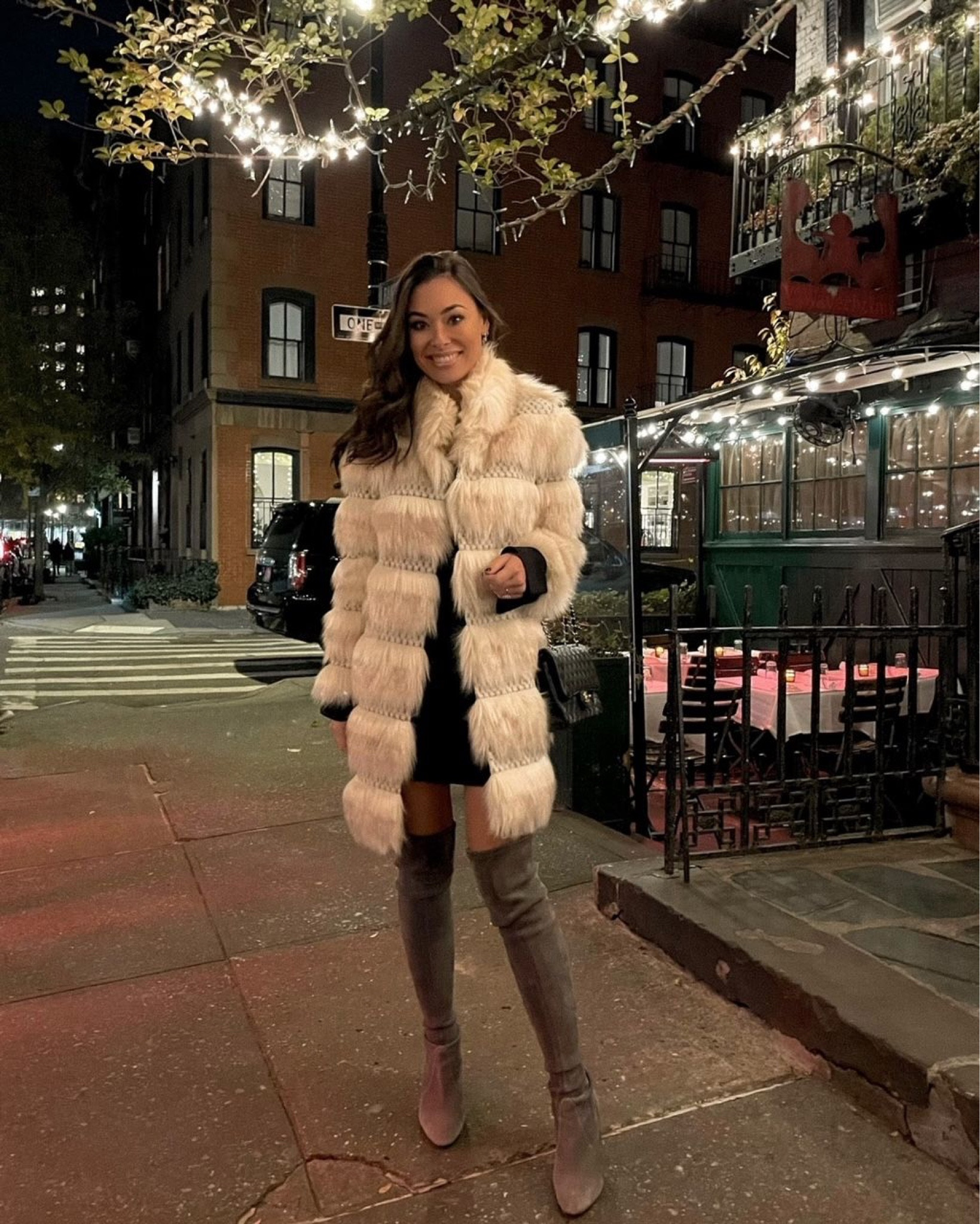 Kat Jamieson of With Love From Kat wears a winter outfit. Suede boots, white fur coat, black dress, mini dress, winter style. 

#LTKSeasonal #LTKshoecrush #LTKHoliday