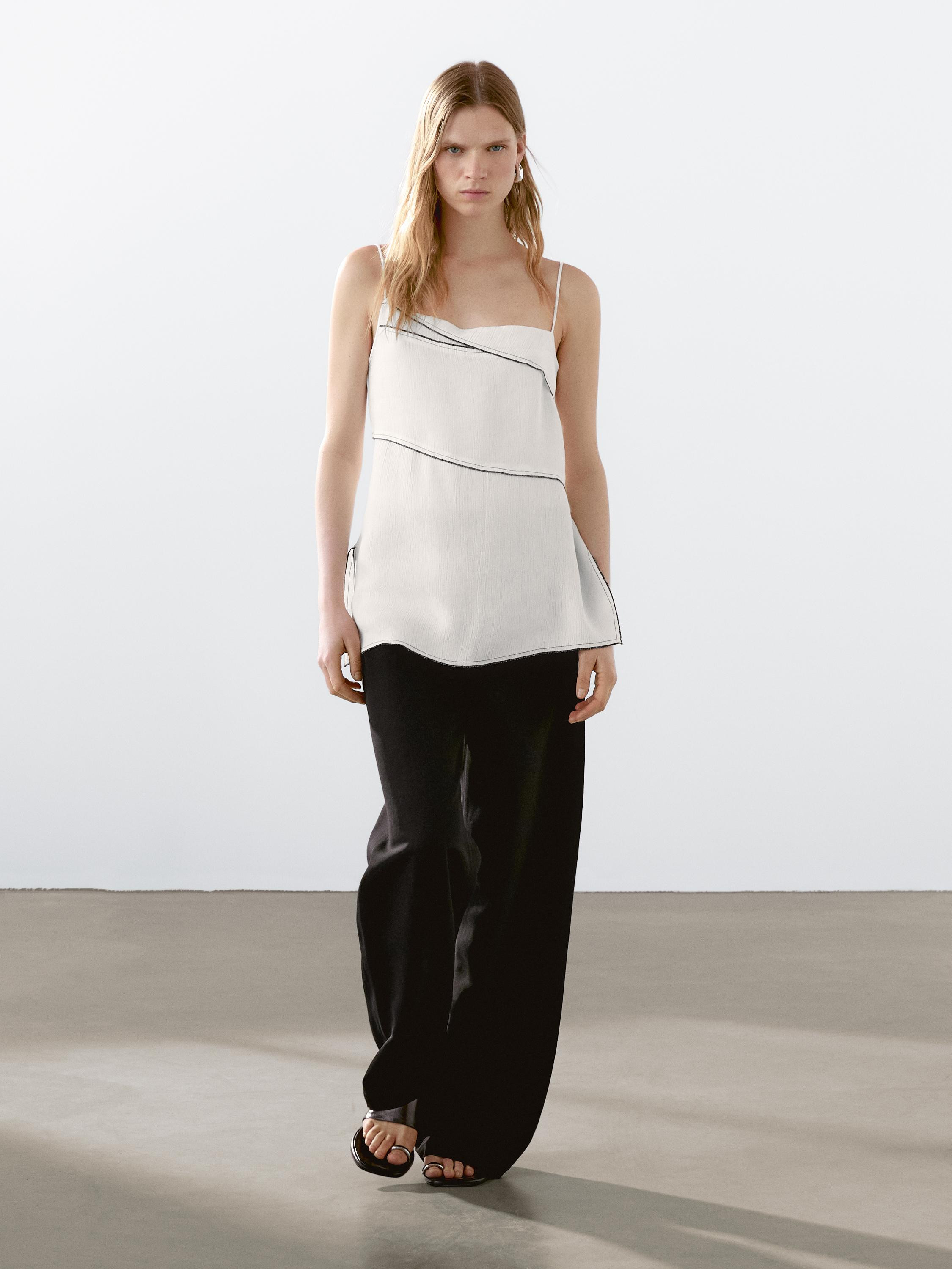 Top made of a linen blend fabric. Strappy. Ruffled detail on the neck . Side vents at the hem. Co... | Massimo Dutti UK