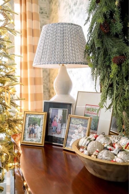 Display your family Christmas cards in frames! Festive decor + wall down memory lane = be still my heart! Frames, gramdnillennial dining room, pleated lamp shade, double gourd lamp

#LTKSeasonal #LTKHoliday #LTKhome