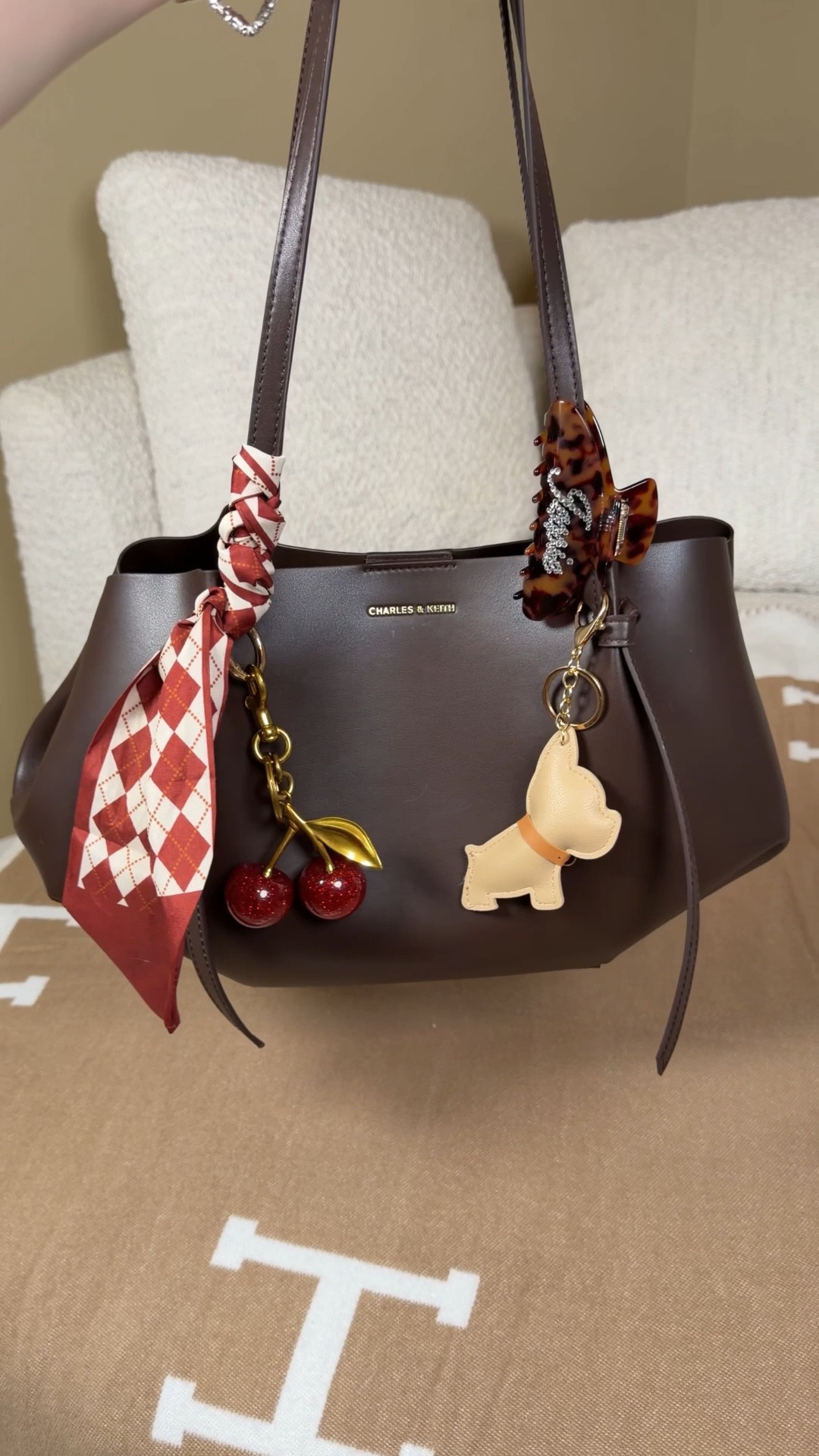 What fits in the Charles and Keith calla tote 

This is the size large in espresso brown and comes with a little attachable pouch inside to store hempz hand lotion, touchland sanitizer, and anything else you need.



#LTKdayinmylife