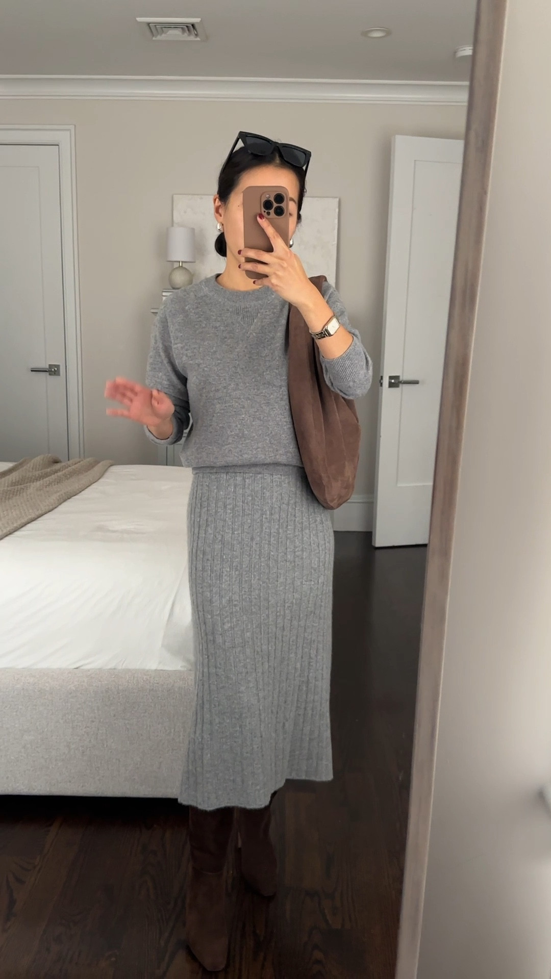 Elevated cozy winter outfit. Trying on this cashmere midi skirt which has lots of coordinating sweaters to match 

•  Cashmere Fisherman Crewneck Sweatshirt xs - more shrunken fit and slightly shorter length. my favorite cashmere layering staple for petites. I own this in several colors.

•Cashmere Midi Skirt xs - runs big. This is a loose fit on me. I have the wider stretchy waistband folded up once here. 

• Old Steve Madden boots 

• Etsy suede hobo bag 

@onequince #quincepartner

Winter workwear, Christmas cozy outfit, sweater skirt sets 

#LTKHoliday 

#LTKWorkwear #LTKFindsUnder100