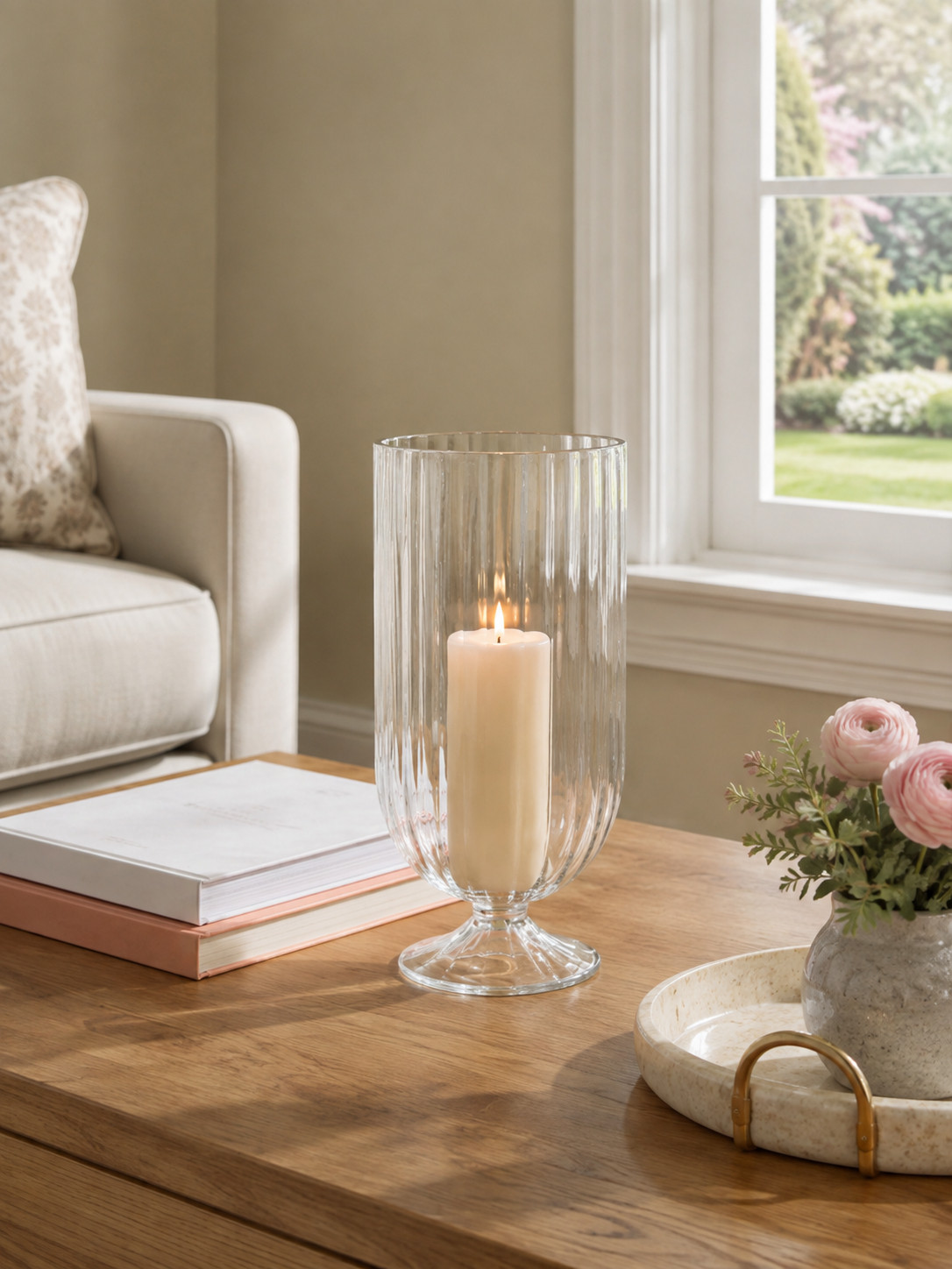 One simple piece that instantly makes a coffee table feel more elevated and cozy. This ribbed glass hurricane + candle is such an easy way to add warmth and a little glow to your space. 

 #LTKHome #LTKSaleAlert