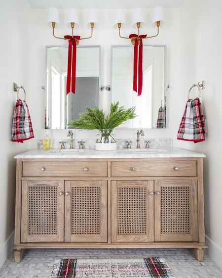 Our guest bathroom decorated for Christmas last year! Includes our wood and cane vanity with marble countertop, silver framed mirrors, red velvet ribbon, faux holiday greenery, and Stewart plaid towels and bath mat!

#ltkholiday #ltkhome #ltkseasonal #ltksalealert #ltkunder50 #ltkunder100 #ltkstyletip Christmas bathroom decor, cozy Christmas decorating, Christmas décor, Christmas towels, Christmas bathroom towels, amazon Christmas, amazon finds, amazon home, pottery barn Christmas, pottery barn bathroom

#LTKHoliday #LTKSeasonal #LTKhome