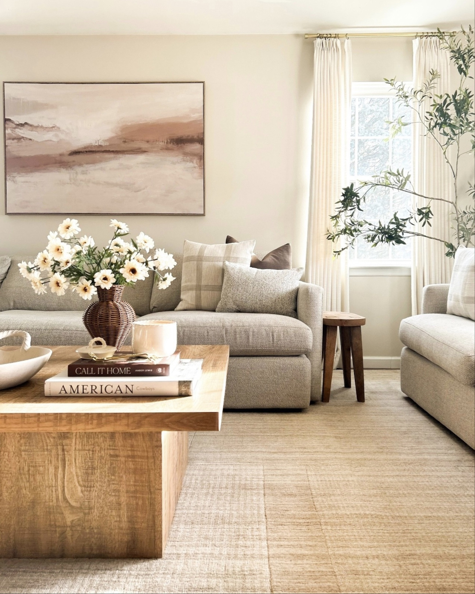 Neutral + cozy living room inspo for spring. 🌼 🤎

Sofa is from @Crate & Barrel 

Crate and Barrel sofa, coffee table, large wall art, Two Pages curtains, spring stems, throw pillows, neutral area rug, living room inspo, beige rug

#LTKStyleTip 

#LTKHome