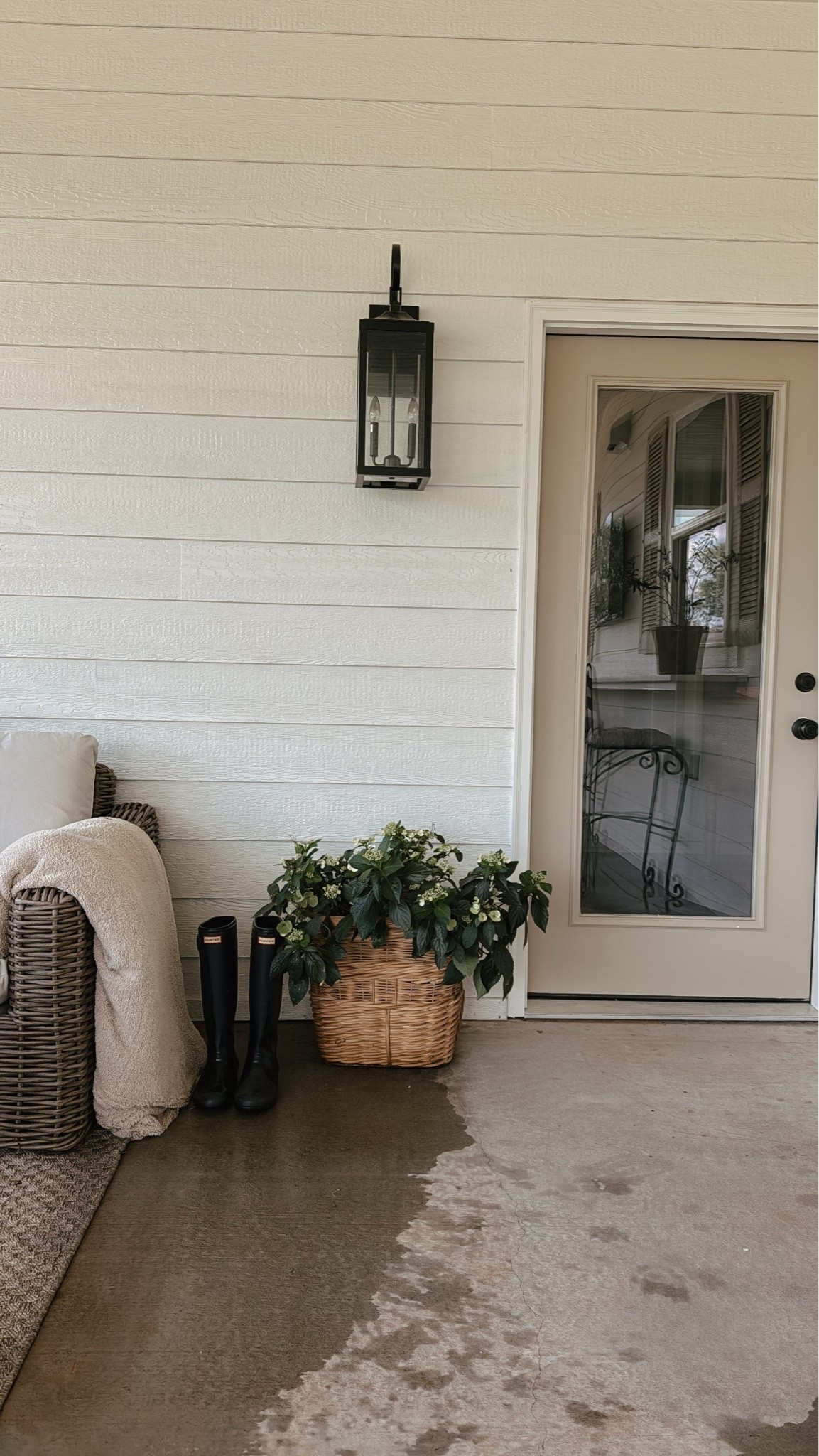 I used this basket from @oliveateliers to hold my fairytale cascading hydrangea. It’s still in its plastic pot inside the basket and I sprayed with waterproof spray on the basket. The color of my flip house is Sherwin Williams oyster white with SW stone lion doors and shutters. This lantern exterior light is super affordable from @lowes

#LTKHome #LTKSeasonal