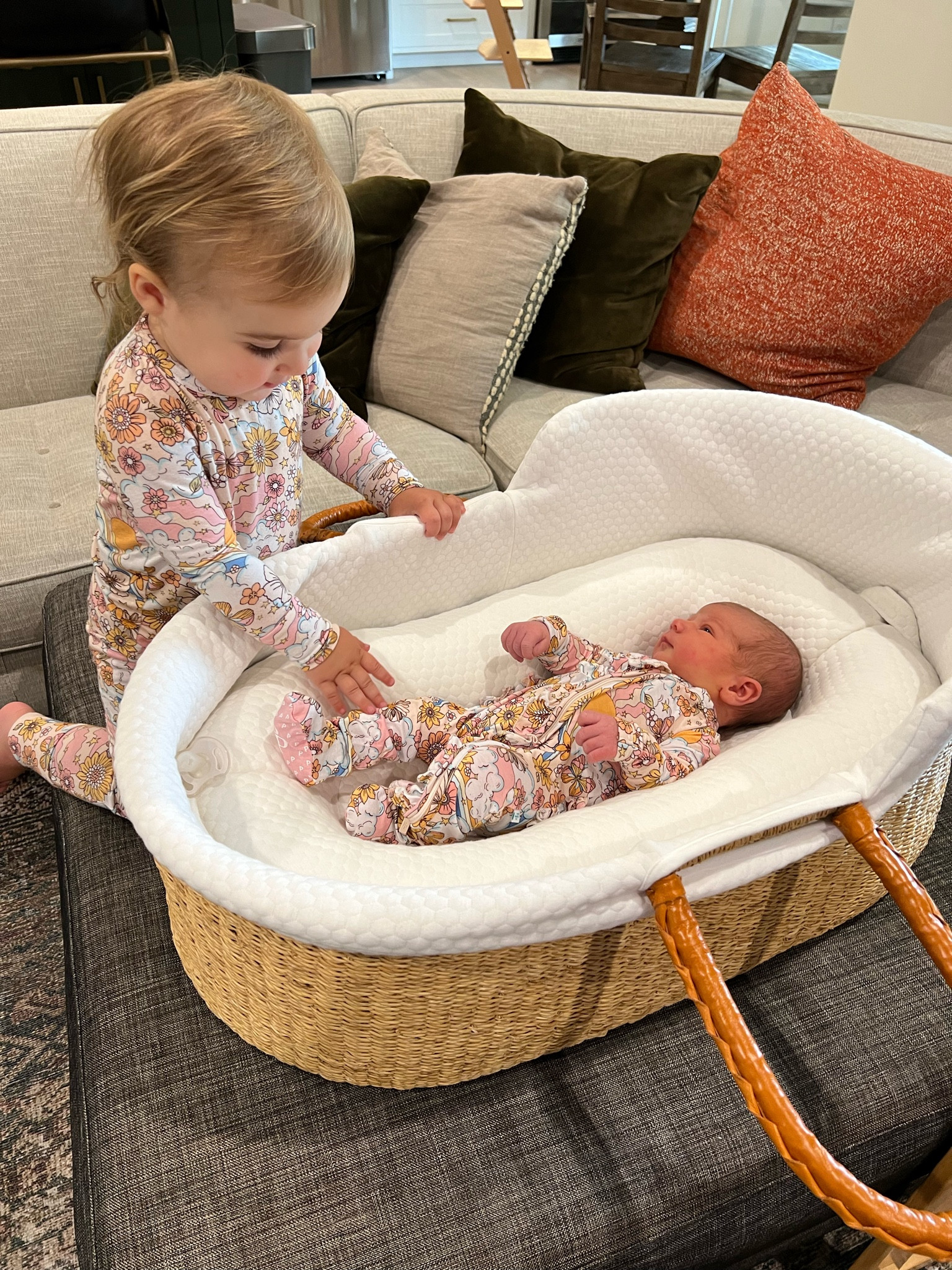 Bassinet and pajamas linked! We love this Moses basket bassinet from design dua. 