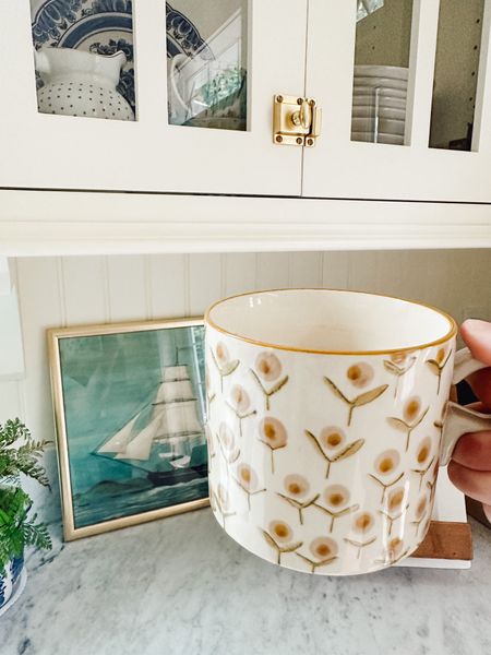 These beautiful mugs come in a set of four different hand stamped mugs. They are what I call a cozy mug, it's easier to use both hands to drink from it -- that will warm your hands and distribute the weight of the mug. A cozy mug for your morning coffee, a delightful ritual! 

(Also linked the brass latch kitchen hardware) 

#LTKstyletip #LTKhome #LTKSeasonal
