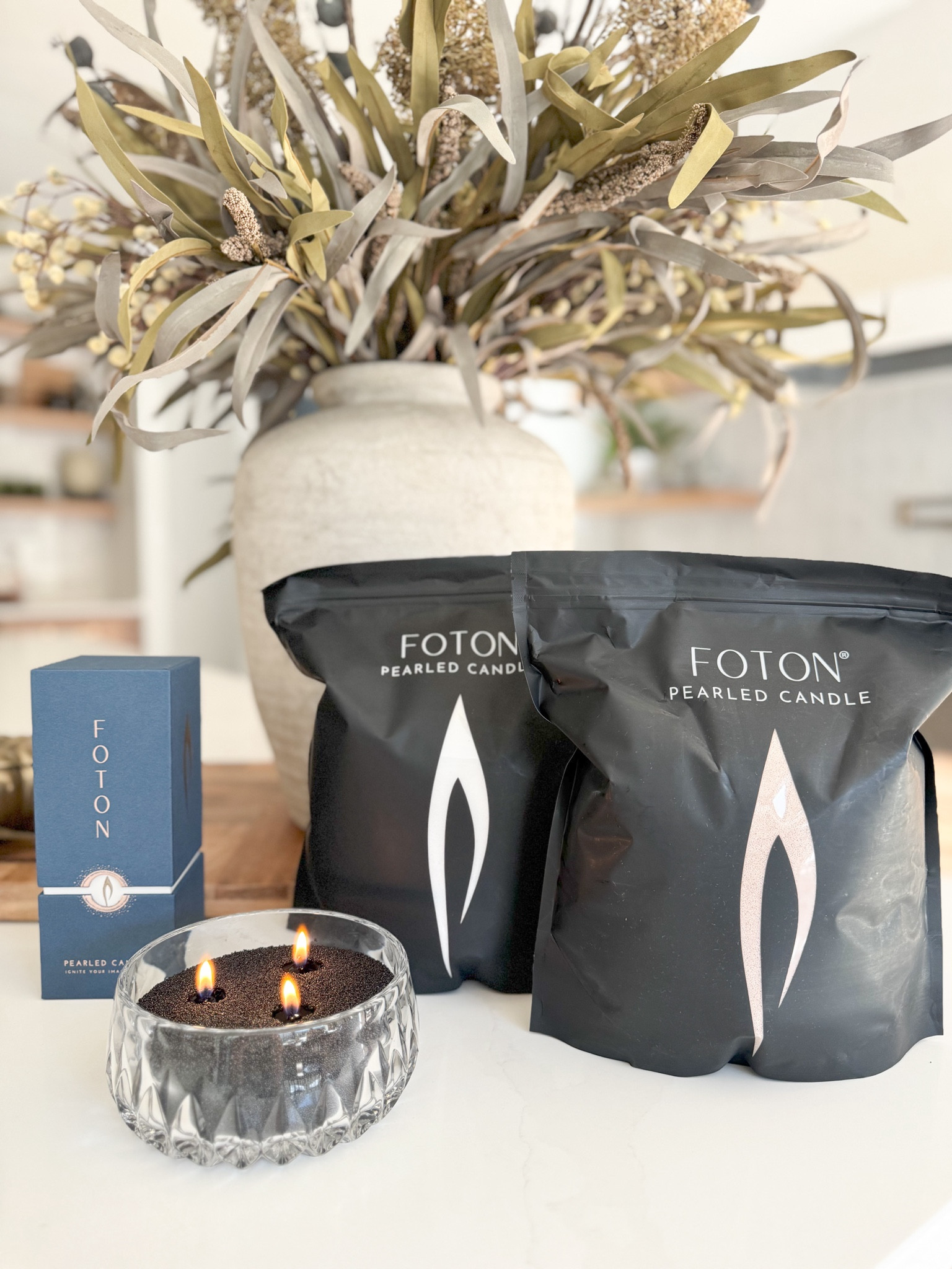I just discovered the magic of Foton's pearled candle! 🕯️ The new black vanilla scent is everything. What I love about this brand is that it’s endlessly customizable—just pour it in a fire-safe vessel, insert the wicks, and enjoy! Plus, the wicks and pearls are reusable. This is my new go-to for cozy vibes! 

@fotoncandle #FotonCandle #HomeFragrance #gifted #candle #pearledcandle #cozyscents #modernfarmhouse #homedecor #homedecorfinds

#LTKHome #LTKFindsUnder50 #LTKGiftGuide
