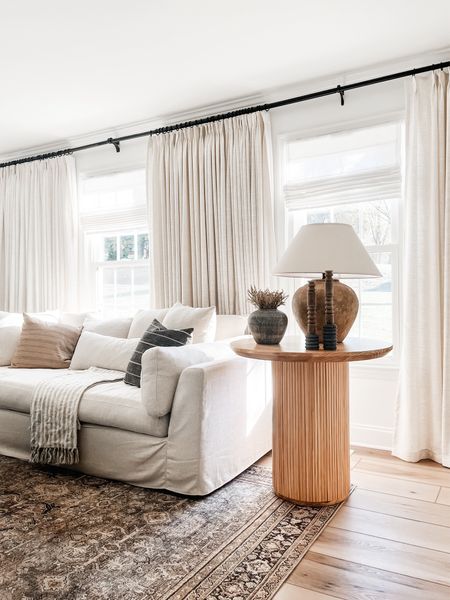 Round accent table, white sofa, linen curtains

#LTKhome