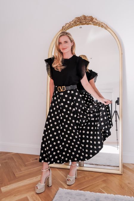 Polka dots are one of my all-time favorite prints... And, that’s why I’m so excited that this season they are VERY on trend!! @Nordstrom #NordstromPartner

To style the polka dot trend, I snagged this gorgeous A-line skirt by English Factory. Isn’t it SO pretty? I can see wearing this look to work, church, weddings, lunches, events, even Easter and Mother’s Day. I love the super flattering and feminine silhouette, classic pleats, and flowy fabric. The length is lovely, it’s fully lined, and it’s only $100! This is a larger-scale polka dot print, which gives it a retro vibe. Fit is true to size. 

I paired the skirt with a pretty flutter-sleeve top. The top is very versatile and only $80! The sleeves help to create a really flattering hourglass figure, and I cinched my waist even further with a chic waist belt (linked a for-less version). 

To finish my look, I added some beautiful nude raffia platform sandals. The scallop details on these are SO pretty. And these are very comfortable for heels, especially with how much height they add. Fit is true to size. 

~Erin xo 

#LTKstyletip #LTKSeasonal #LTKfindsunder100