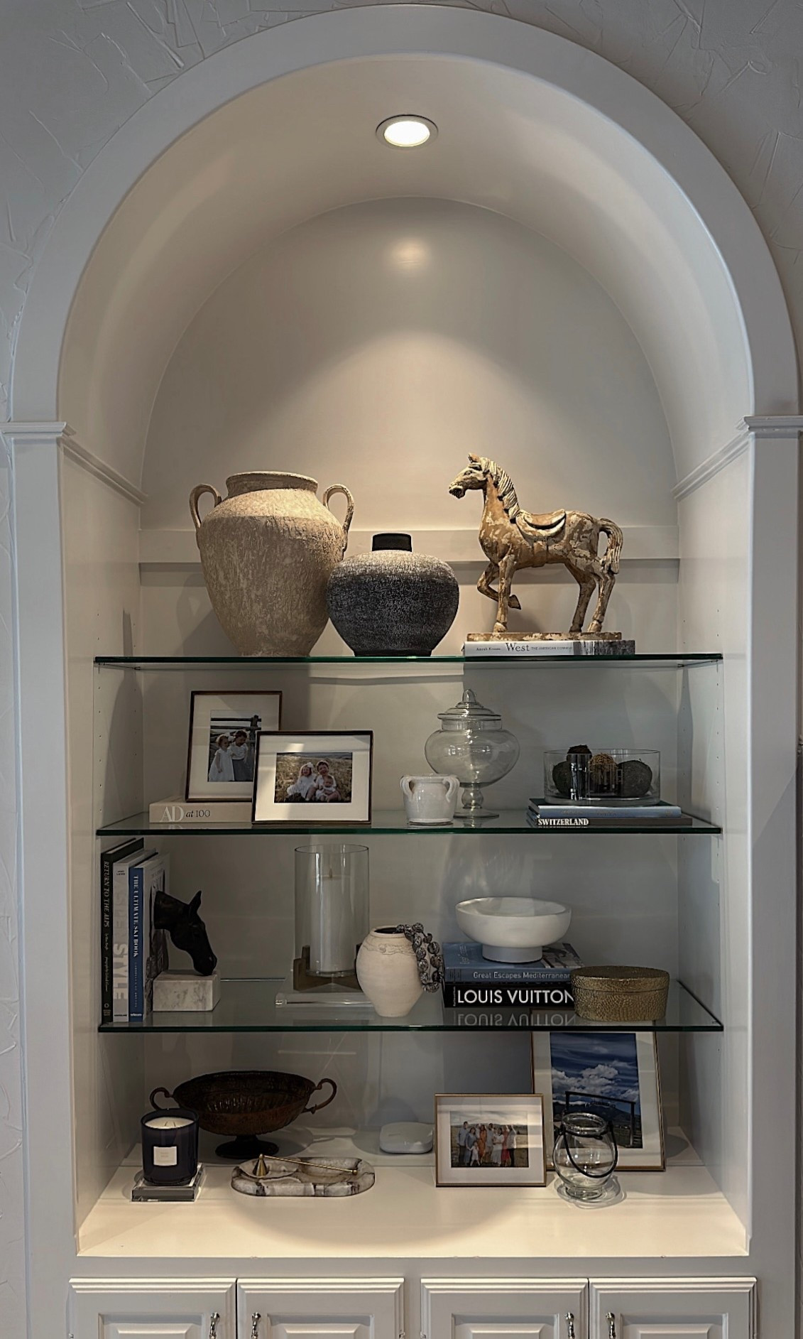 I recently restyled some shelves for a friend of mine who’s a proud horse girl, so naturally, I wanted to incorporate elements that reflect her personality and passions. 🐴 For me, it’s all about layering—using decorative objects to elevate the overall aesthetic and bring a space to life. Every vase, sculpture, candle, piece of art, and figurine is carefully selected not just to match the room’s design, but to tell a story that’s personal to the client. While these items might not serve a practical function, they’re essential for setting the mood and adding texture, color, and character to an interior. 

#Shelfie #ShelfStyling #DallasHomes #DallasDesign #Equestrian #TexasHome #TexasStyle #TexasHomeDesign #MorganPageDesigns

#LTKHome