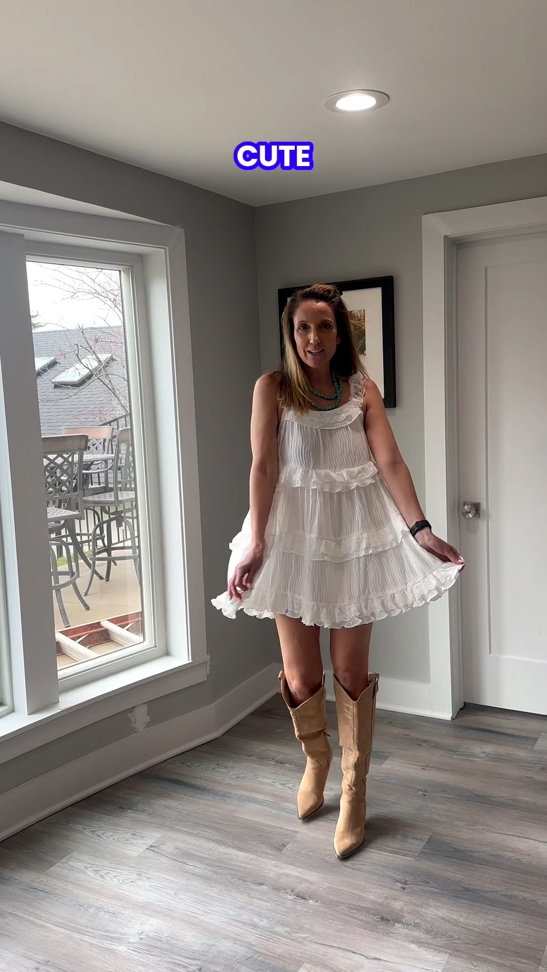 Sticking to light textures and earthy tones for a polished afternoon out. 🎀🌿 A little white dress is a wardrobe must-have, especially when paired with statement boots that draw the eye. Check out the link in my bio to shop this look and refresh your own dressier rotation! 🌟 #StyleInspo #RuffledDress #WesternFashion #ShopMyLook

My Western Whimsy Style Breakdown
• The Dress: I’m wearing a sleeveless, tiered white mini dress featuring delicate ruffled hems and textured fabric.
• The Footwear: I finished the look with knee-high, pointed-toe suede boots in a warm tan shade, adding a rugged contrast to the soft dress.
• The Jewelry: A chunky turquoise beaded necklace provides a vibrant, southwestern-inspired focal point.
• The Details: My hair is styled half-up with a small clip, keeping the look relaxed and focused on the neckline details.
• The Vibe: This is the definition of "boho-western"—it’s a fresh, feminine take on classic prairie elements that's perfect for a spring festival or a weekend brunch.

white ruffled dress, tiered mini dress, sleeveless white dress, tan suede boots, knee high western boots, turquoise beaded necklace, boho spring outfit, modern western style, feminine festival look, LTKstyle @VICI 

#LTKFestival #LTKOver40 #LTKTravel
