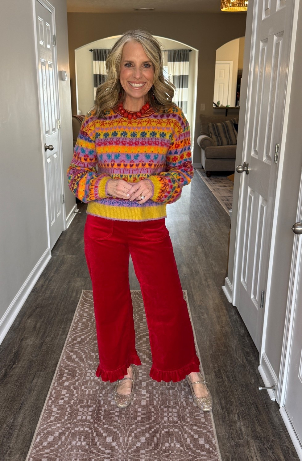 Love this colorful sweater and it’s perfect with the red velvet pants. 

#LTKOver40 #LTKHoliday