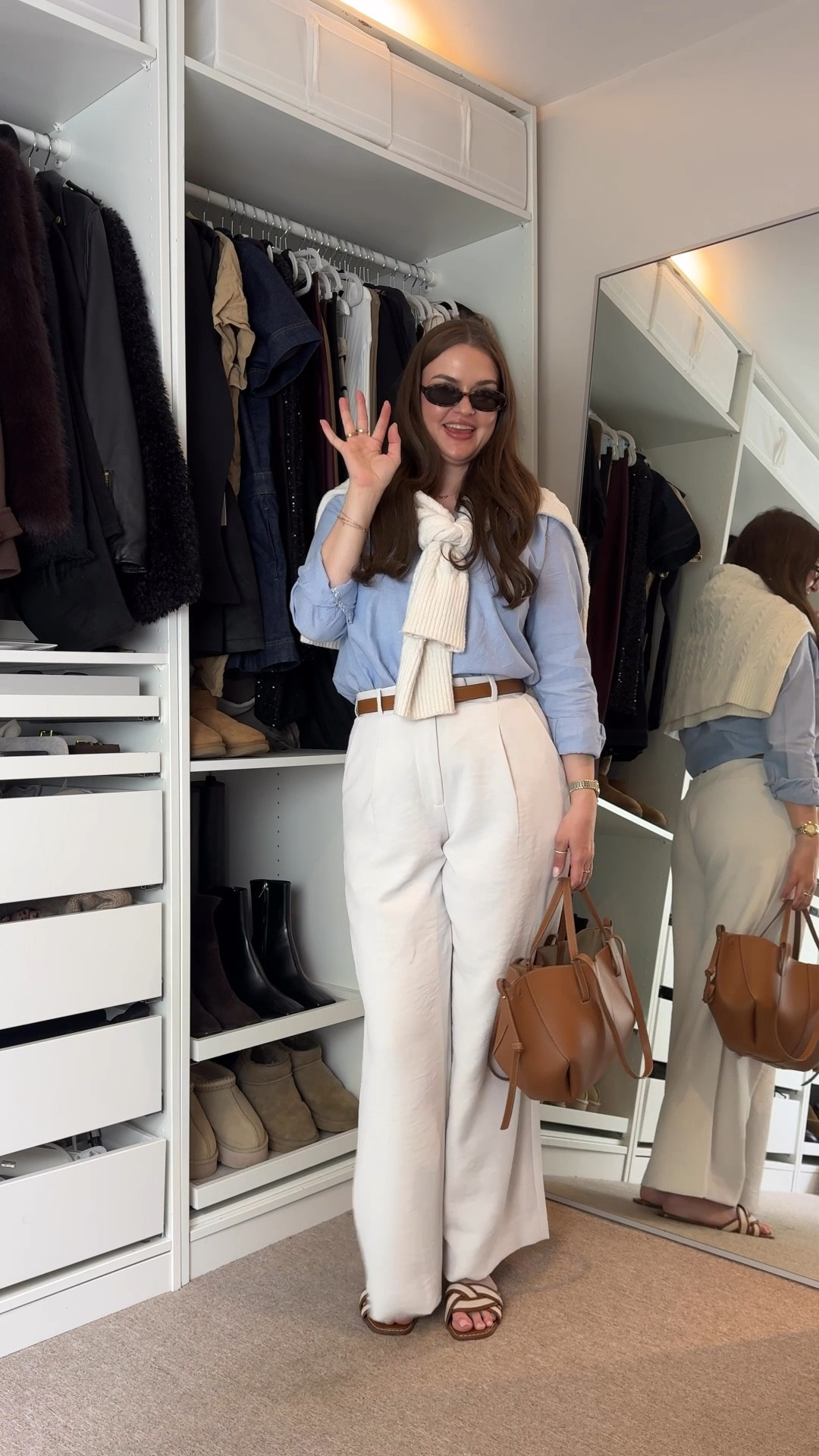 A classic spring summer outfit idea - Abercrombie white tailored trousers, blue cotton shirt, H&M tan sandals, polene Paris tan brown cyme mini handbag, Hermes brown belt, cable knit jumper over the shoulders & le specs outta love tort sunglasses 

#LTKstyletip #LTKuk #LTKspring