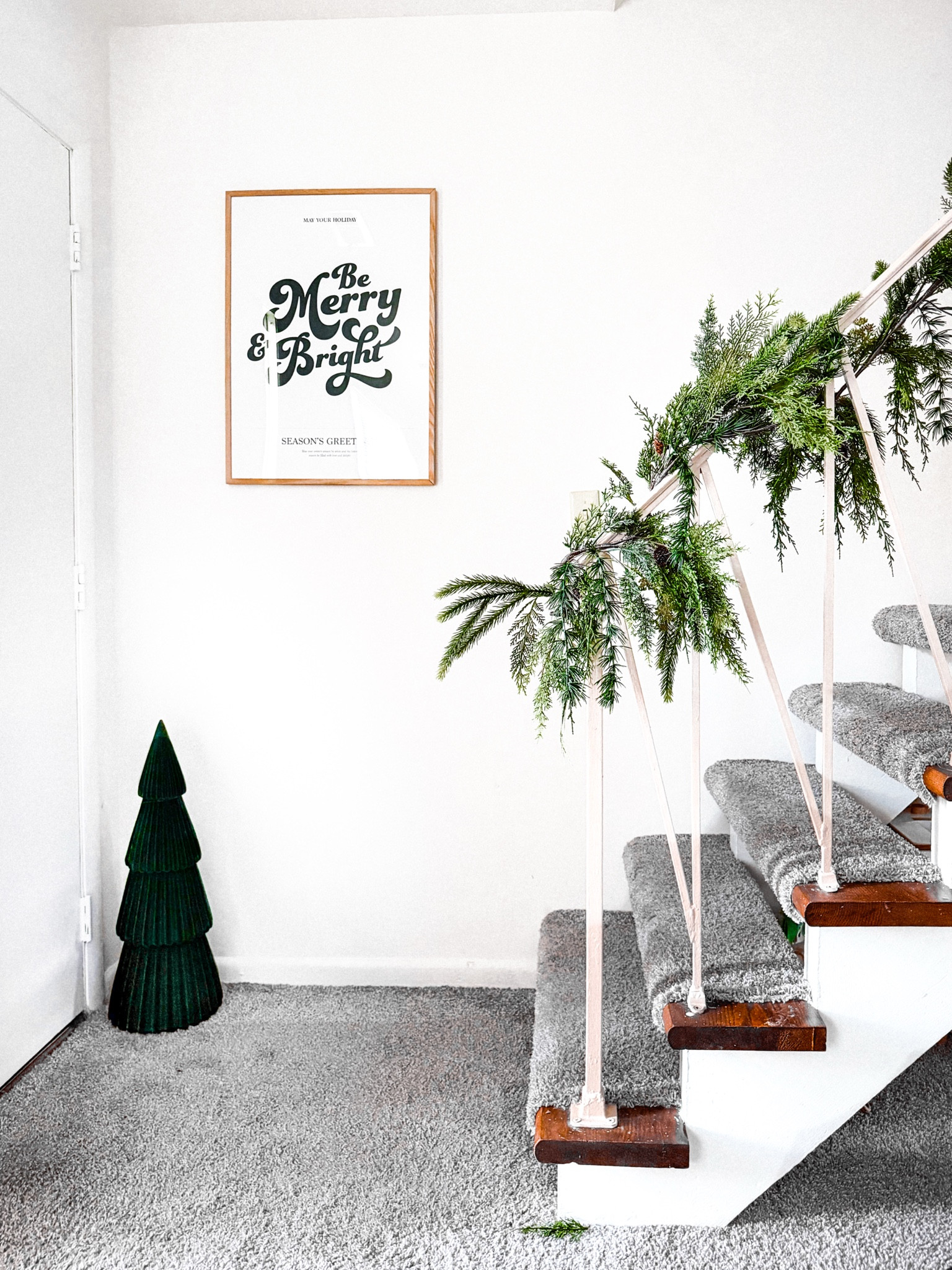 Christmas decor is out 🎄 and this little spot in my entryway has become my absolute fav corner in my home 🥹 so minimalistic yet festive af! ♥️ #christmasdecor #entrywaystyling #posters #wallprints #garland 

#LTKHome #LTKHoliday #LTKSeasonal