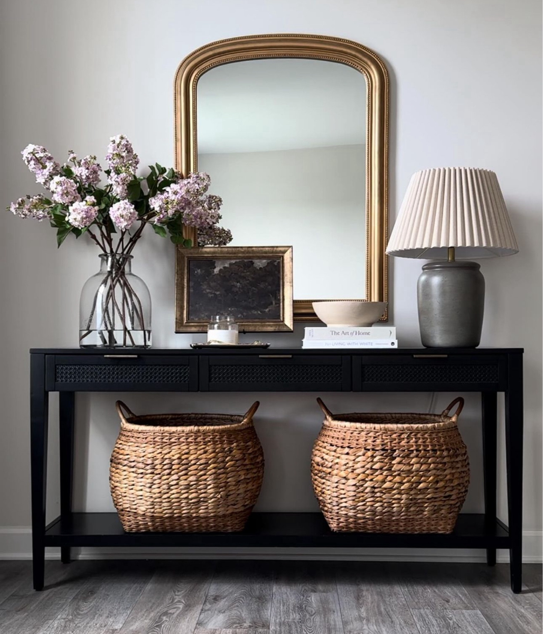 Black Studio McGee console styling. McGee & co Kelby glass vase. Afloral lilacs. Hearth and hand vase. Gold arched mirror.

#LTKhome #LTKsalealert