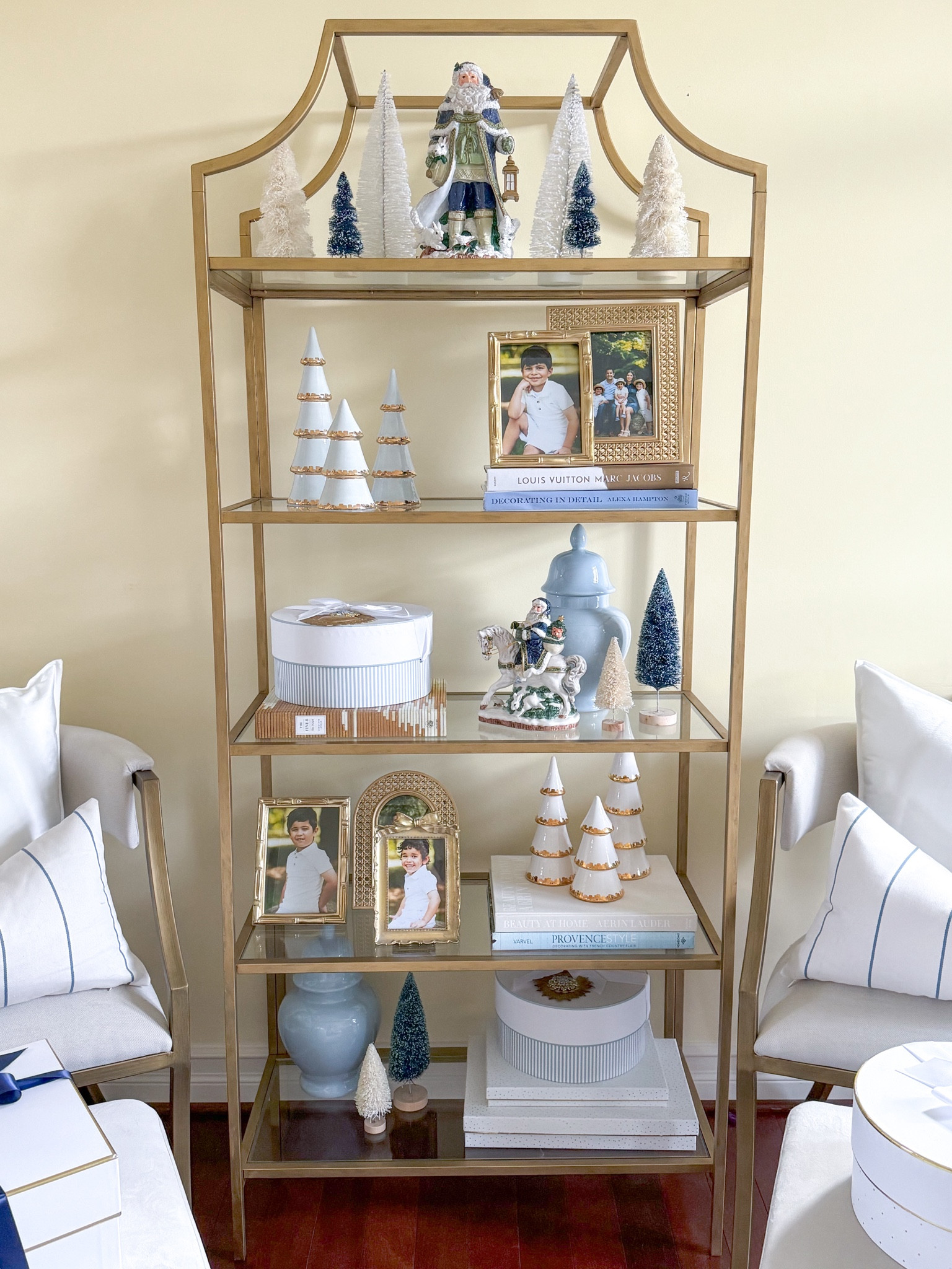 Shop my etagere styled for Christmas! 

Gold Christmas trees, bottle brush trees, gold picture frames, Lauren Haskell, blue ginger jar, Santa figurines, blue Santa, Fitz and Floyd, blue and white decor, grand millennial, gift boxes 

#LTKHoliday #LTKHome #LTKGiftGuide