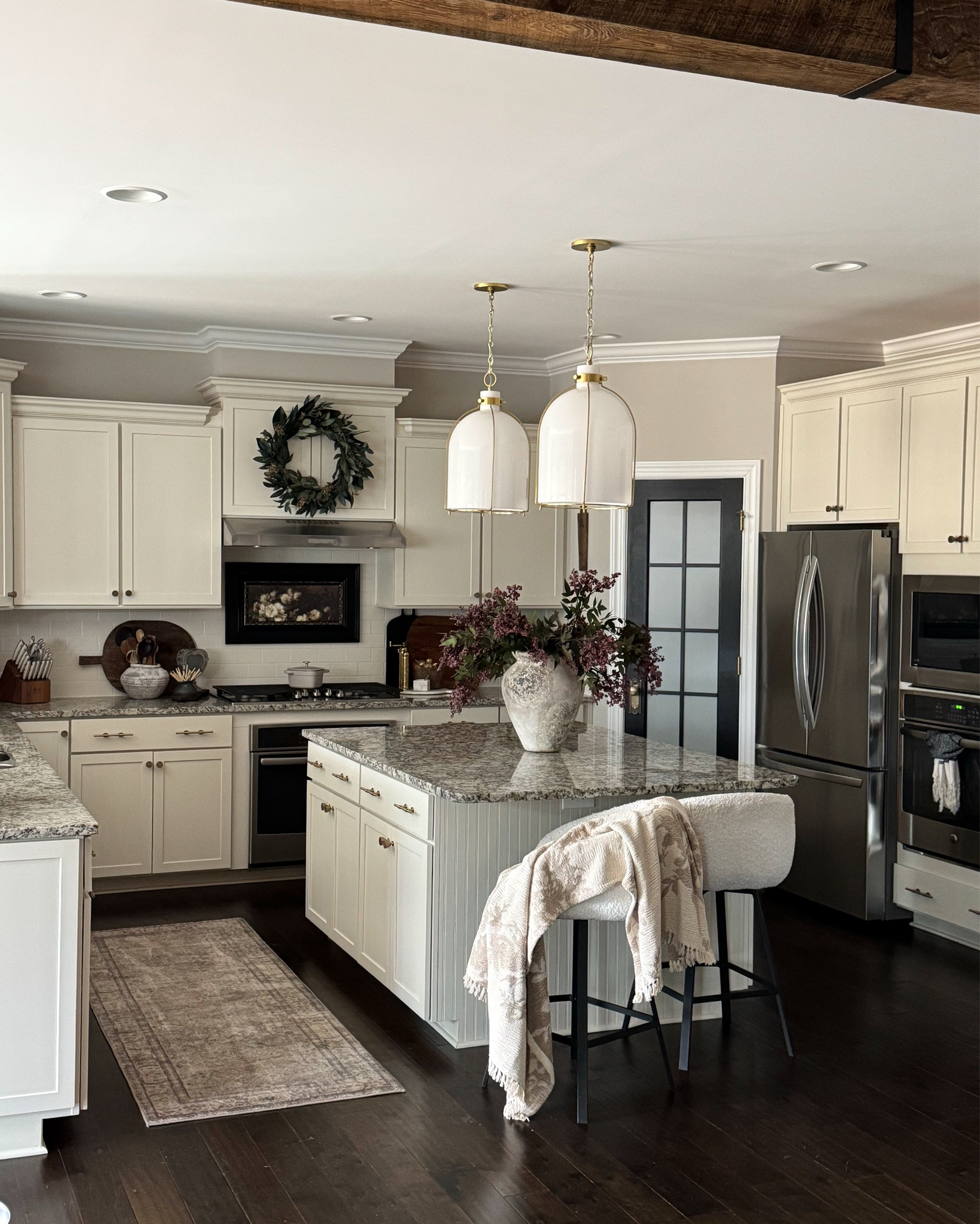 Friday Photos of Home Lately!! Cozy Kitchen

White glass pendants, counter stools, throw blanket, runner, wreath, brass salt & pepper mills, vintage cutting board, dusty plum stems, console table, ottomans, greenery stems, stone pedestal, vintage 5 gallon pot, vintage wood bowls, rice stems, glass cylinder, flameless candles, heart lantern

#LTKHome #LTKSeasonal #LTKstorytime