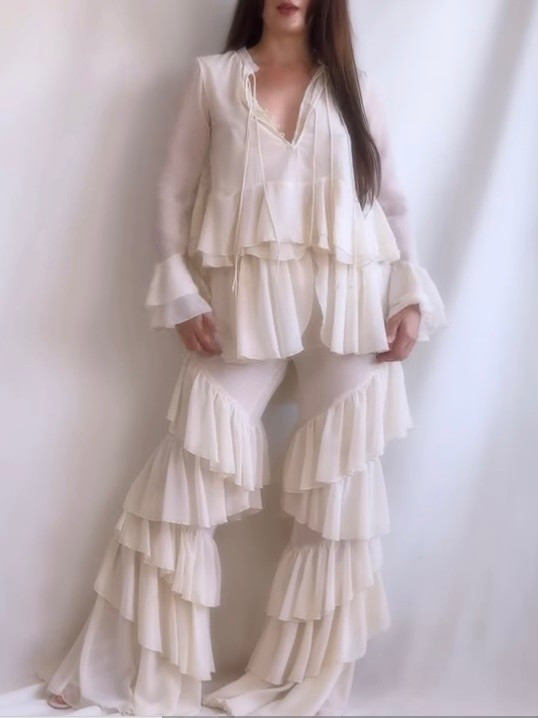 Boho elegance in its most effortless form ✨

This flowing set features a lightweight top paired with ultra-long, voluminous trousers in soft beige chiffon. The cascading ruffle details and fluid movement create a dreamy silhouette that feels both relaxed and elevated at the same time.

I love how the fabric moves with every step — it’s the perfect look for warm summer days, sunset moments, or any occasion where you want to feel comfortable yet beautifully styled.

Tap to explore similar pieces and recreate this bohemian-inspired look 🤍

#LTKespana #LTKeurope #LTKsummer