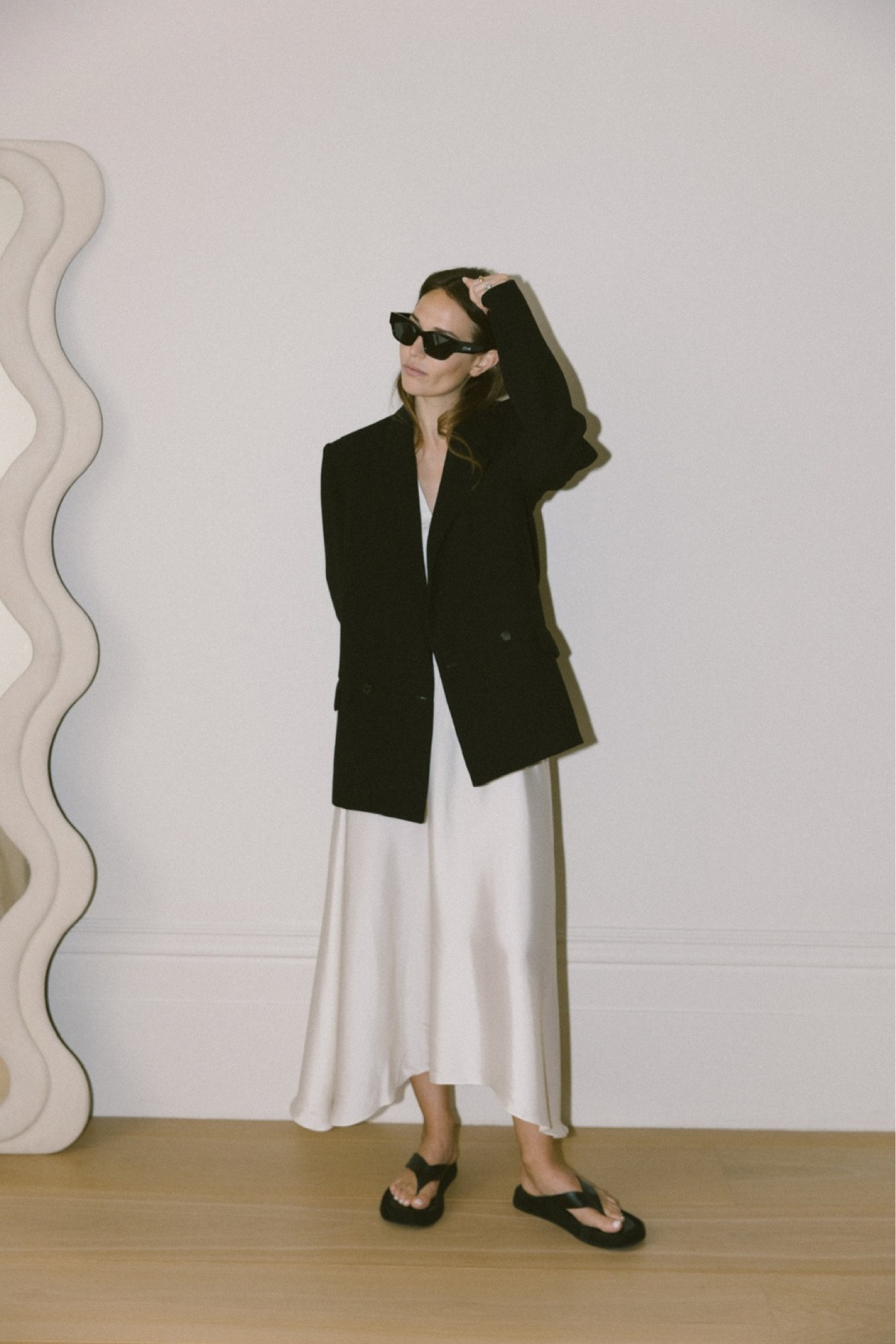 CHIC MONOCHROME 

I love how chic and yet unefforted this look feels when I put it on. The relaxed cut of this satin, handkerchief hem skirt from ARKET feels so fluid on the body and the fabric moves beautiful when you walk - you would be forgiven for thinking it was designer. Anchored with a flat-form sandal (these are from THE ROW) and a heavy weight blazer with a sharp silhouette and exaggerated shoulder (this is WARDROBE NYC X HAILEY BIEBER) you could wear this from day to night, from lunch to a smart evening event. 

#RILEYUGGLA 

Day-to-night dressing, satin skirt, maxi skirt, cream maxi skirt, white maxi skirt, silk skirt, satin skirt, bias cut, handkerchief hem, flat-form sandal, toe-post sandal, smart flip flop, blazer and skirt, monochrome look, smart outfit, summer outfit. 

#LTKstyletip #LTKSeasonal #LTKU